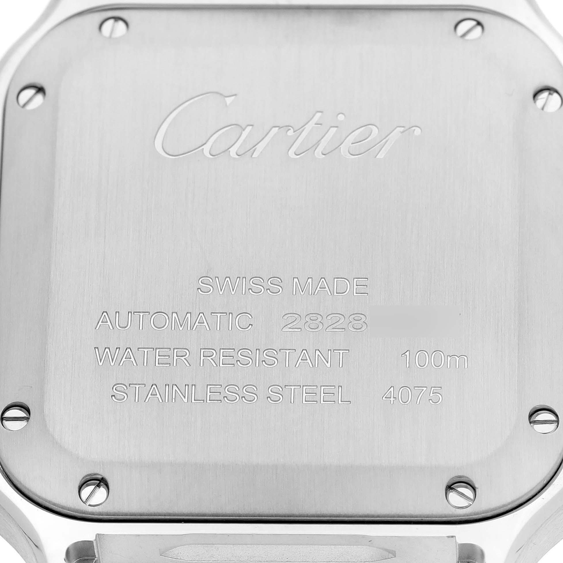The image shows the back of a Cartier Santos W2SA0016 Men's Stainless Steel Silver Dial watch with engravings detailing its specifications.