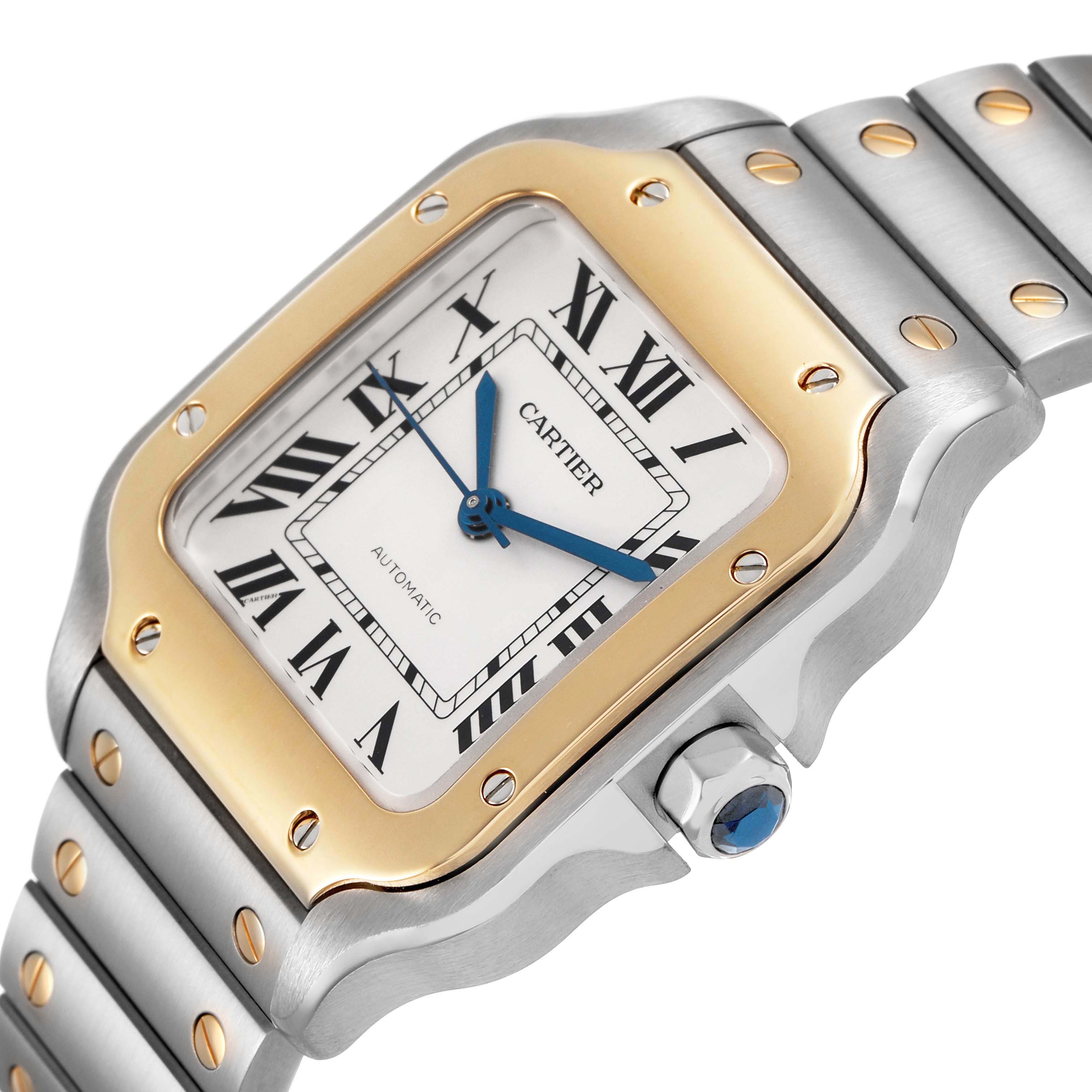 The Cartier Santos W2SA0016 Men's Stainless Steel Silver Dial watch is shown at a slight angle, highlighting its face, bezel, and part of the bracelet.