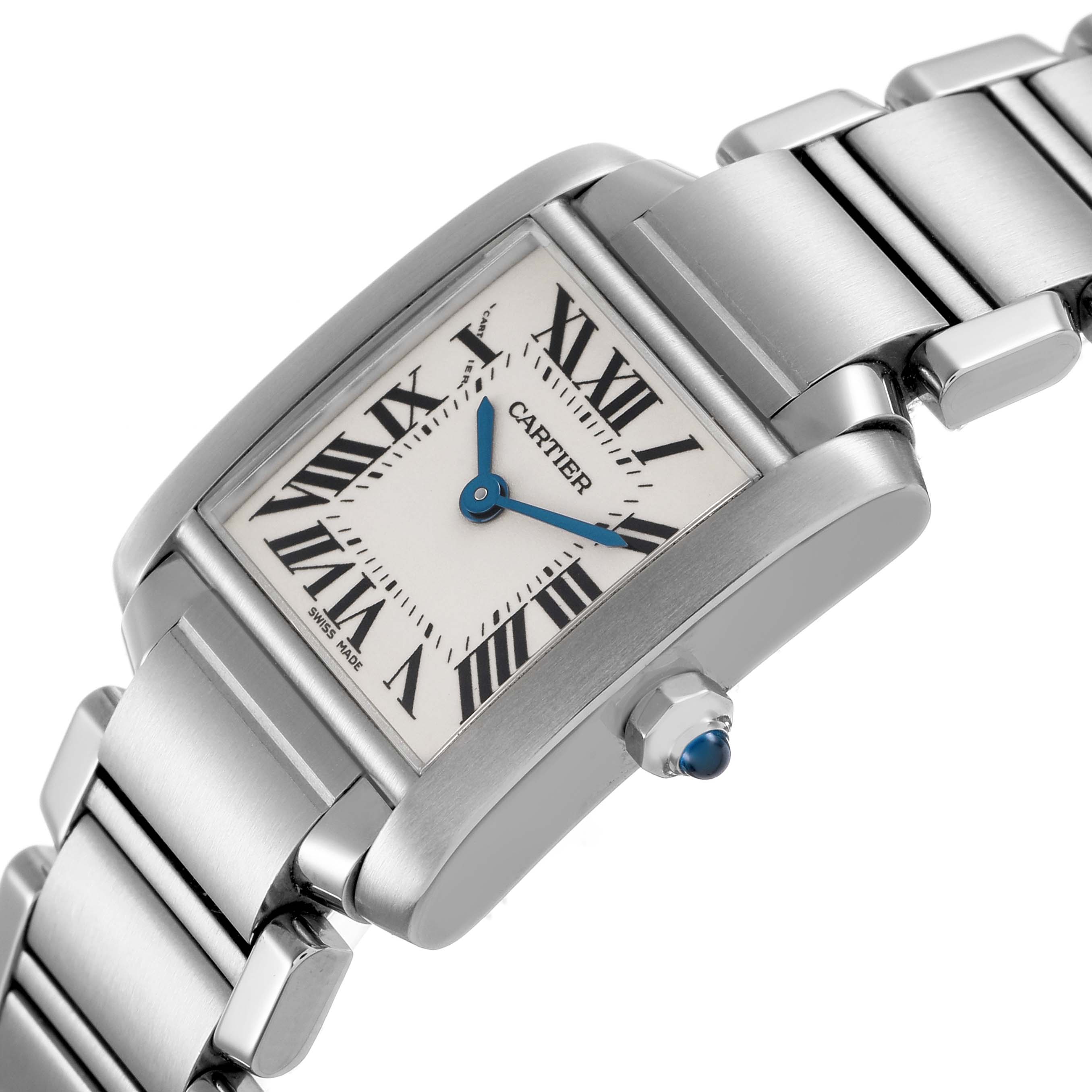 The Cartier Tank Française watch is shown at a slight angle, displaying the dial, bezel, bracelet, and crown with a blue cabochon.
