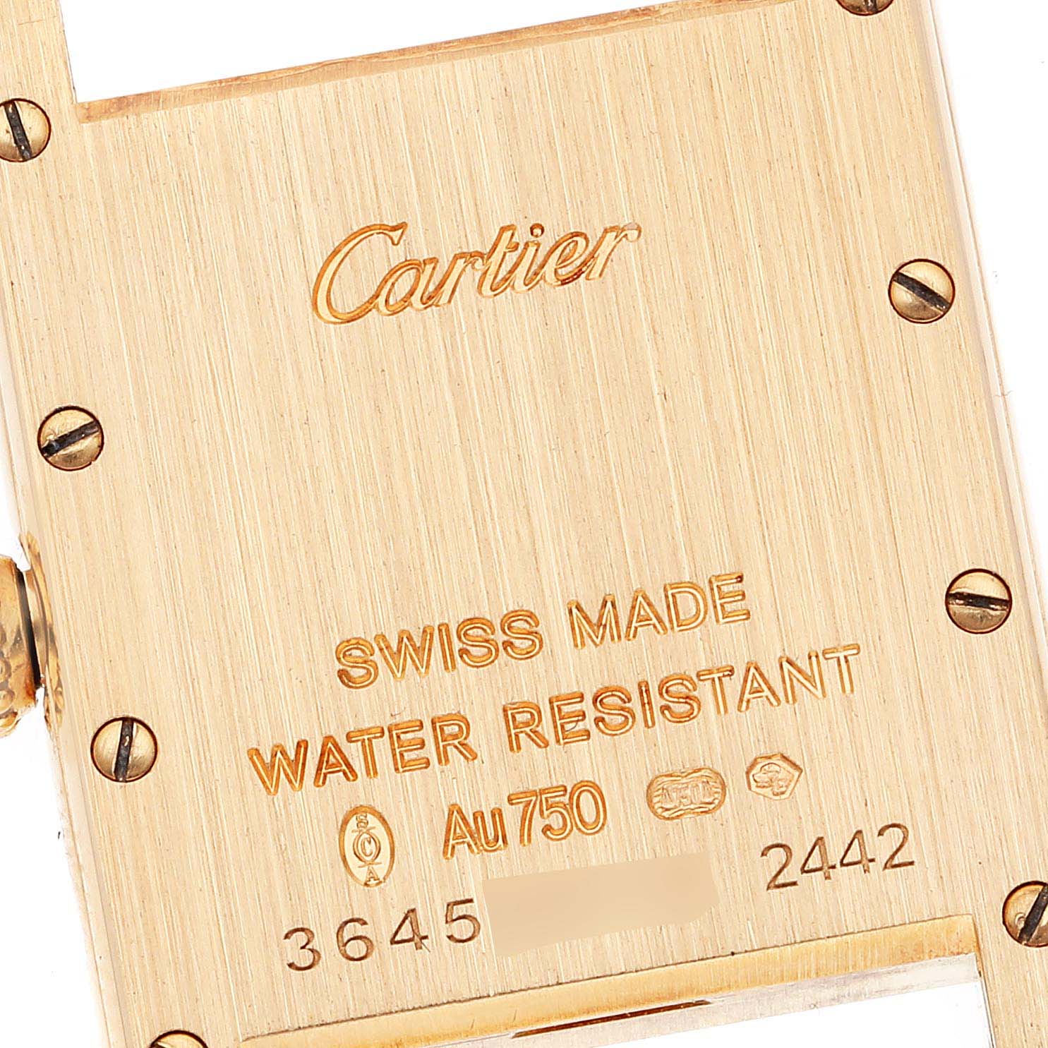 The image shows the back case of a Cartier Tank Louis W1529856 Women's Yellow Gold Silver Dial W1529856 Women's Yellow Gold Silver Dial watch, highlighting its markings and screws.