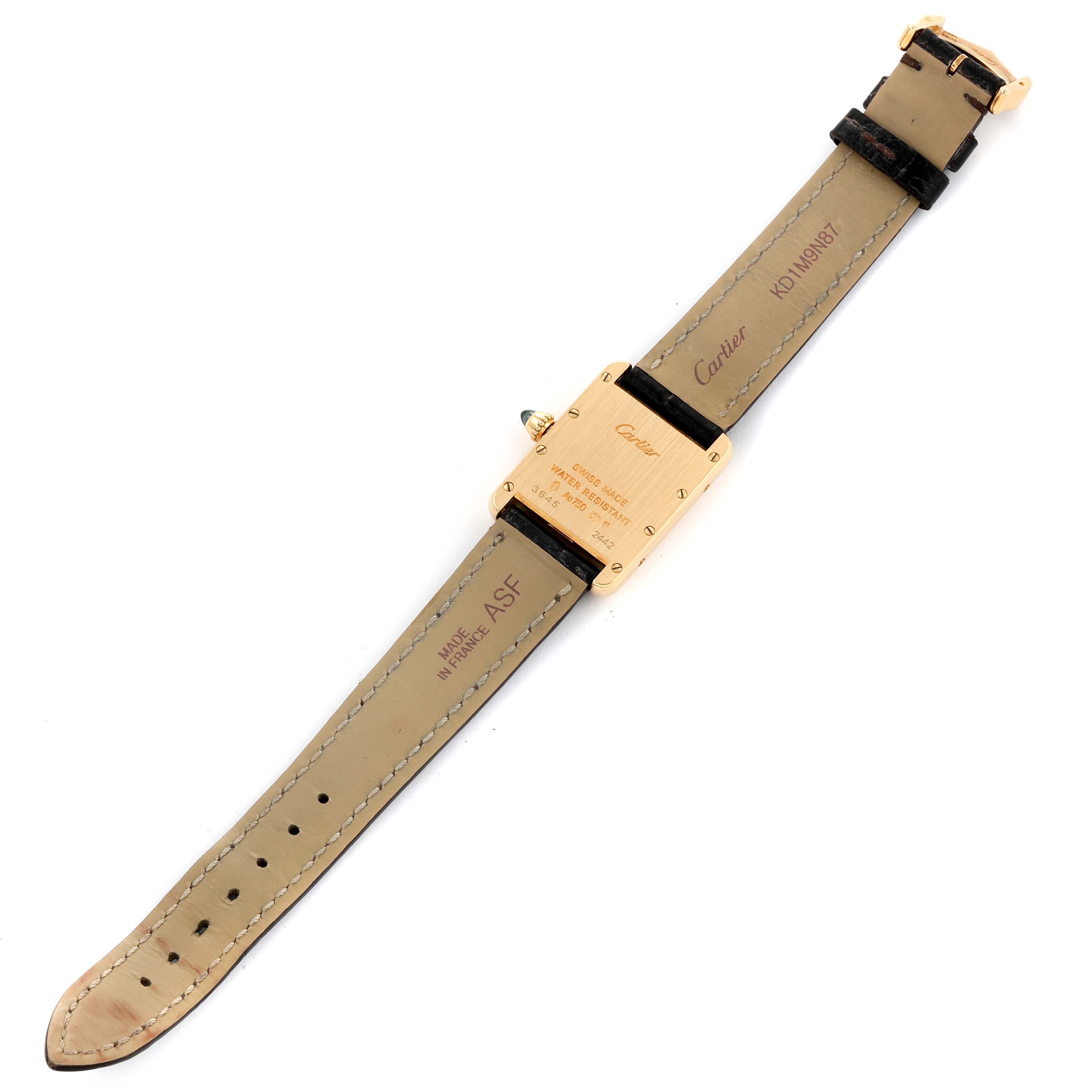 The image shows the back side of the Tank Louis watch by Cartier, displaying the straps and case back.