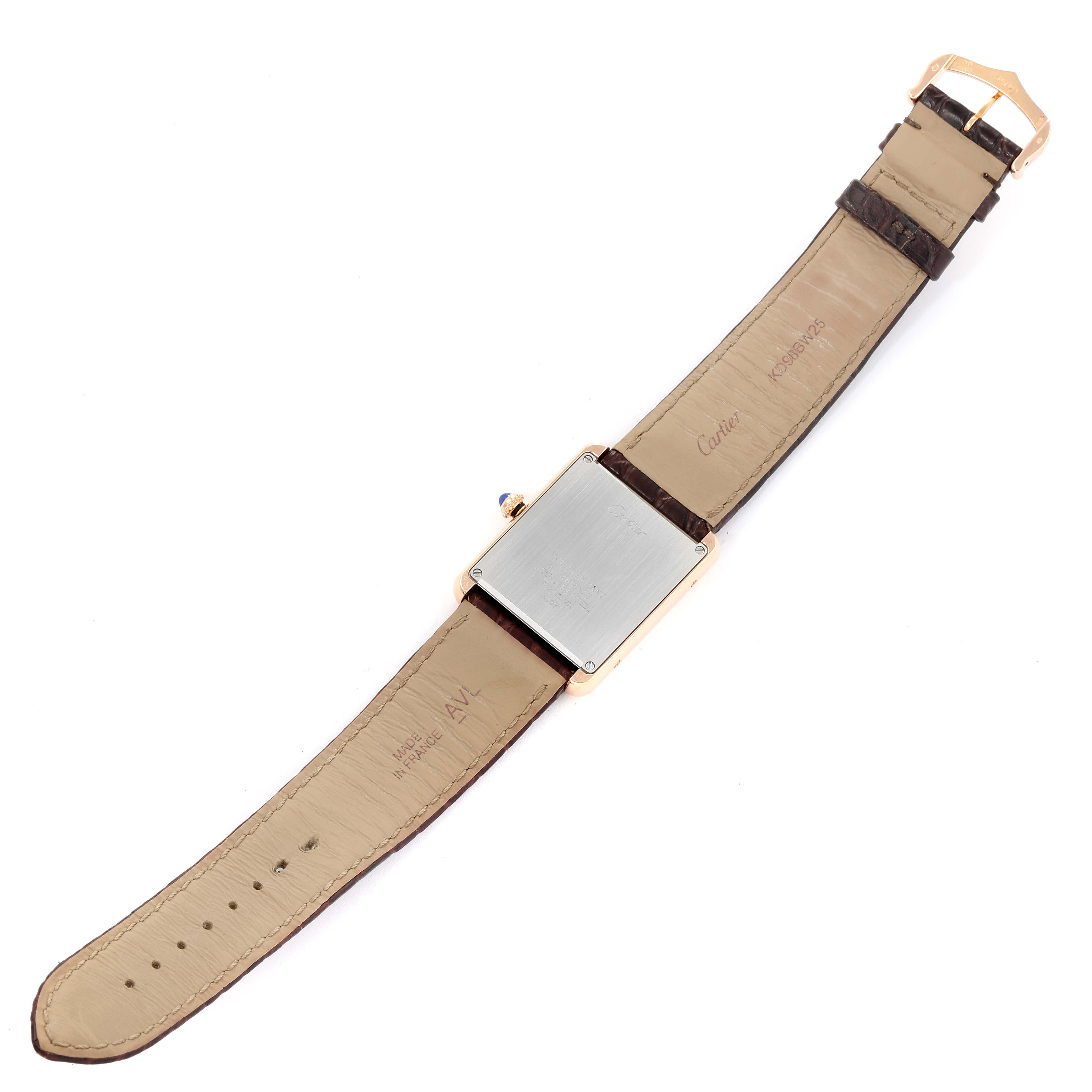 This image shows the back and straps of a Cartier Tank Solo W5200025 Men
s Rose Gold Silver Dial W5200025 Men
s Rose Gold Silver Dial watch laid flat.