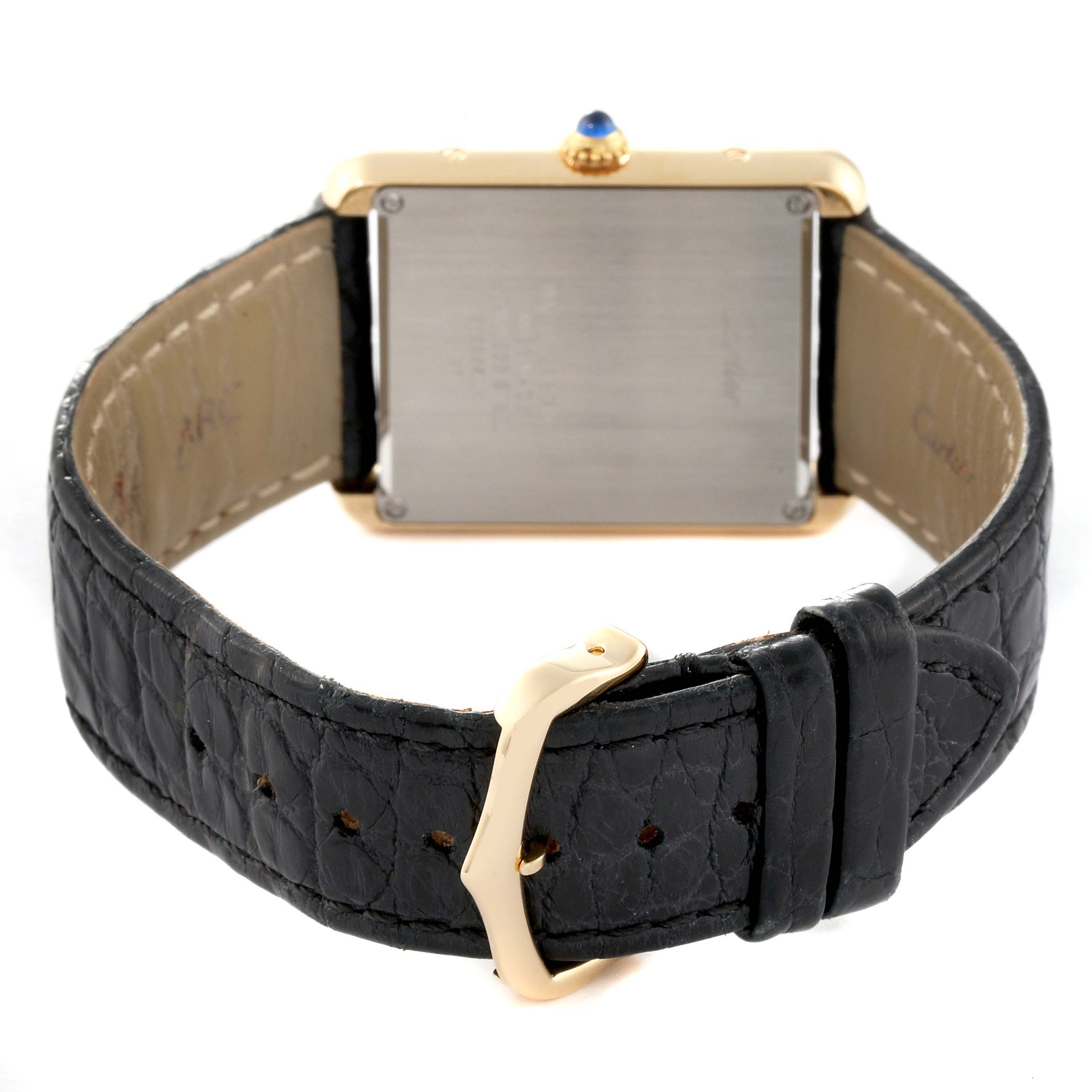 This image shows the rear view of the Cartier Tank Solo W5200004 Men's Yellow Gold Silver Dial W5200004 Men's Yellow Gold Silver Dial watch, highlighting its case back, black leather strap, and buckle.