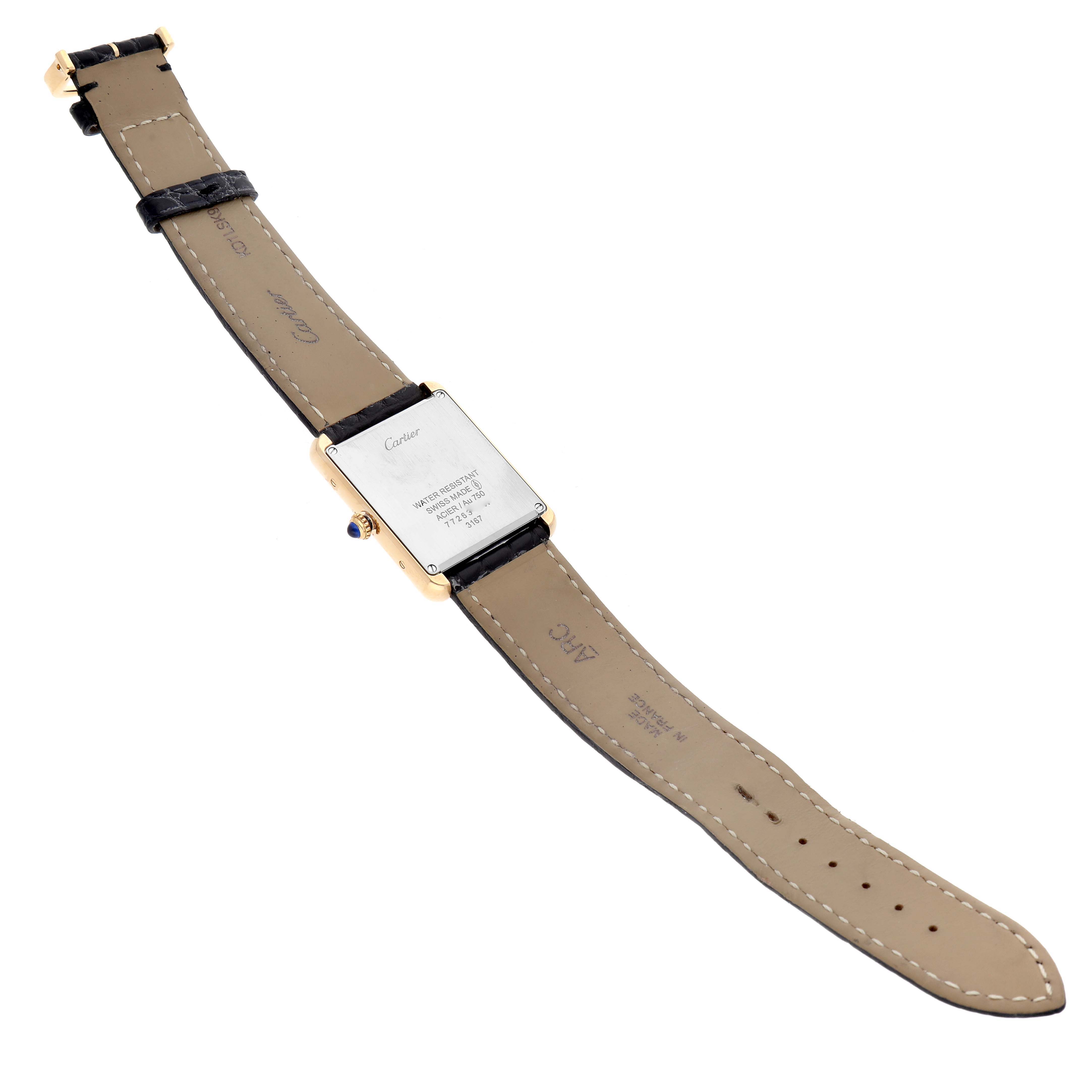 The image shows the back and straps of a Cartier Tank Solo 62230 Men
s Yellow Gold Silver Dial 62230 Men
s Yellow Gold Silver Dial watch laid flat.