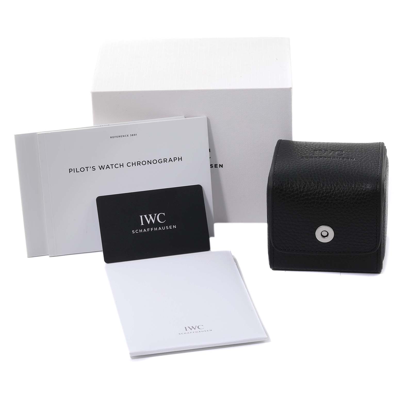 The image shows a box, manual, warranty card, papers, and a travel case for the IWC Pilot IW389105 Men's Ceramic Grey Dial IW389105 Men's Ceramic Grey Dial model watch from a front angle.