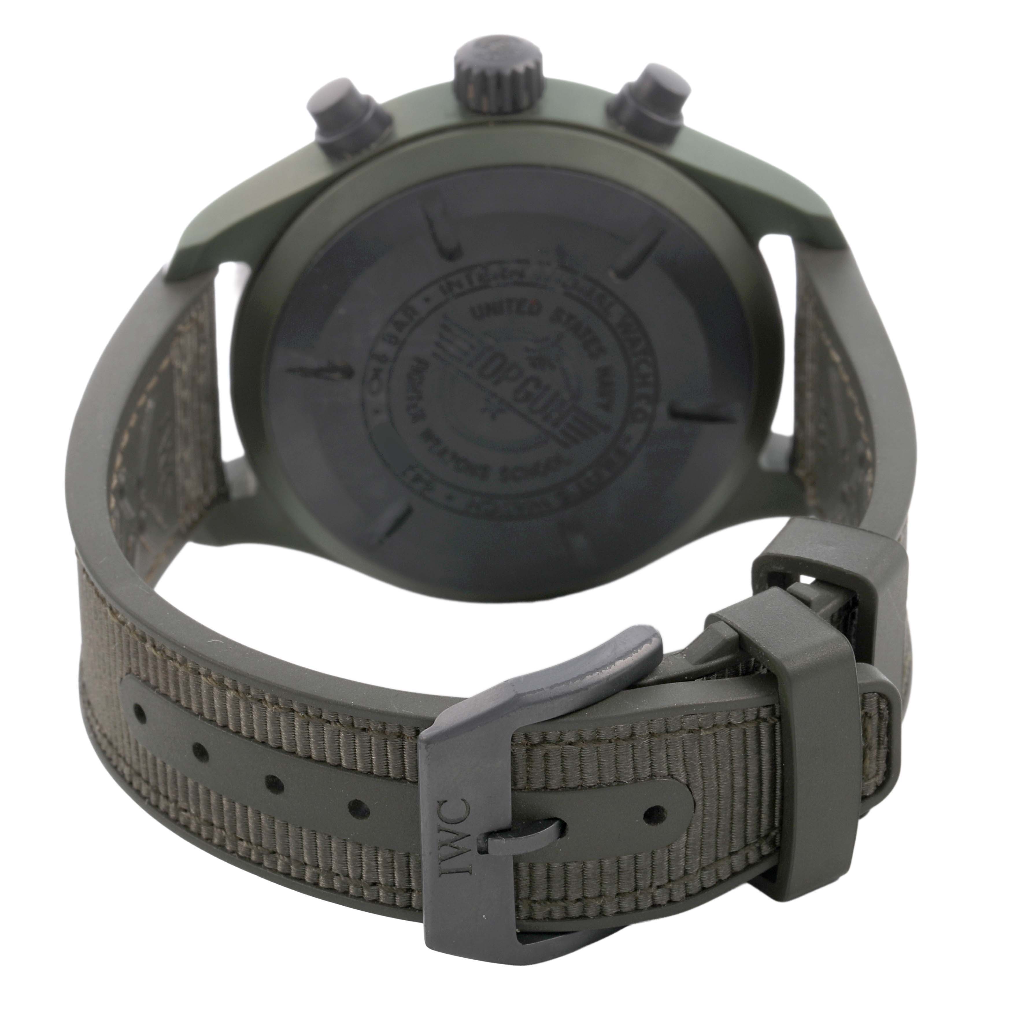 The image shows the back and buckle of the IWC Pilot IW389106 Men's Ceramic Green Dial model watch, featuring its caseback and textured strap.