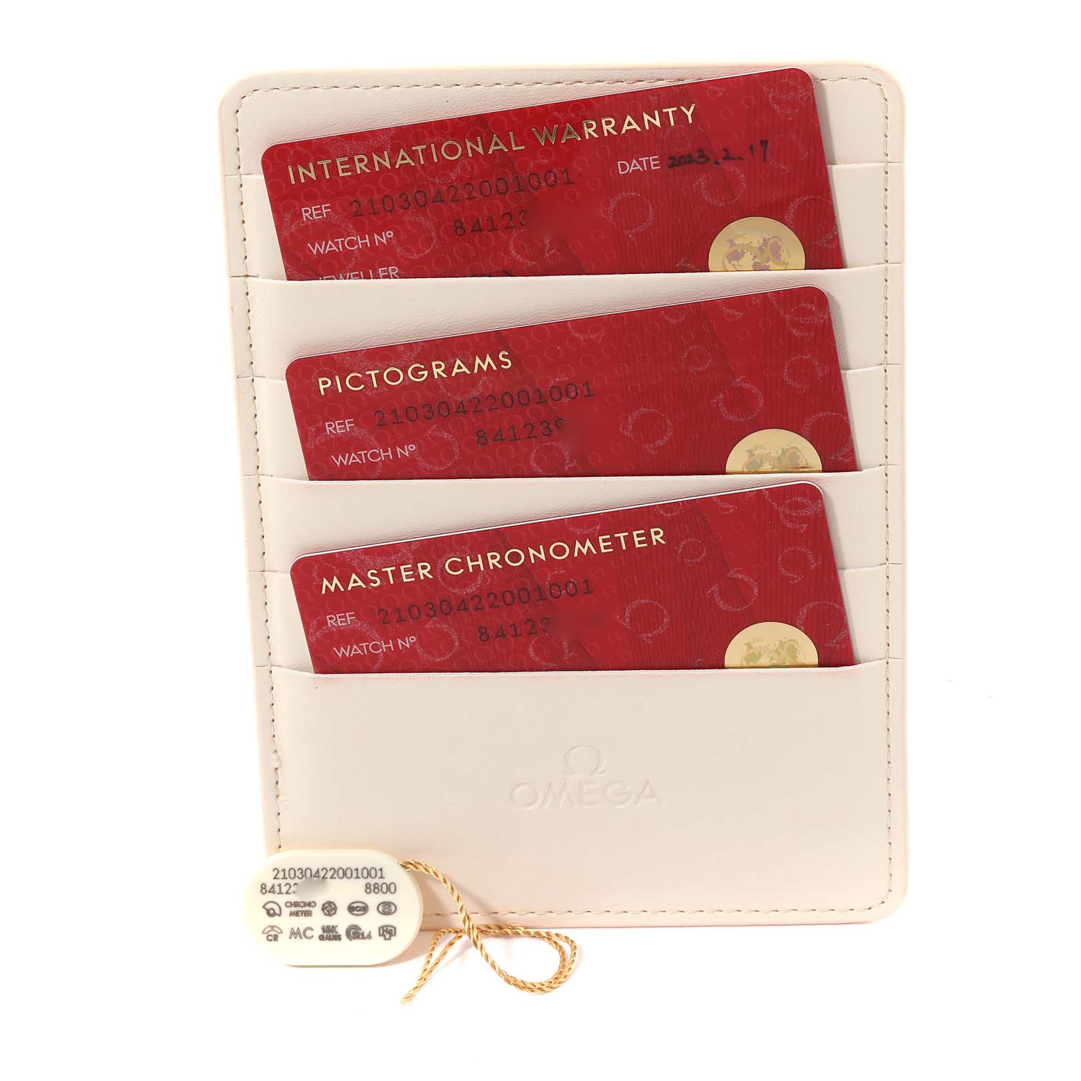 The image shows warranty cards and a tag for the Omega Seamaster 210.30.42.20.01.001 Men
s Stainless Steel Black Dial 210.30.42.20.01.001 Men
s Stainless Steel Black Dial watch arranged in a white card holder.