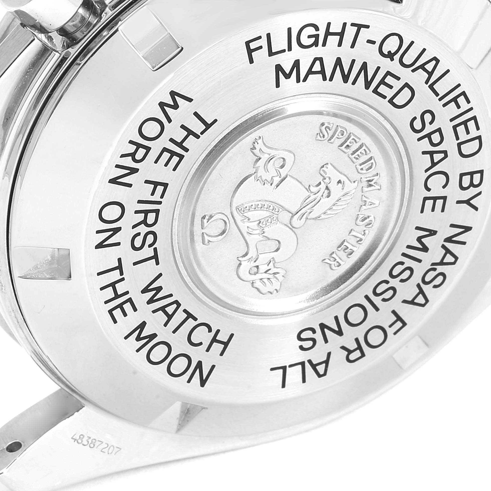 The image shows the engraved case back of an Omega Speedmaster 3570.50.00 Men
s Stainless Steel Black Dial 3570.50.00 Men
s Stainless Steel Black Dial watch, highlighting its NASA qualification and moon landing inscription.
