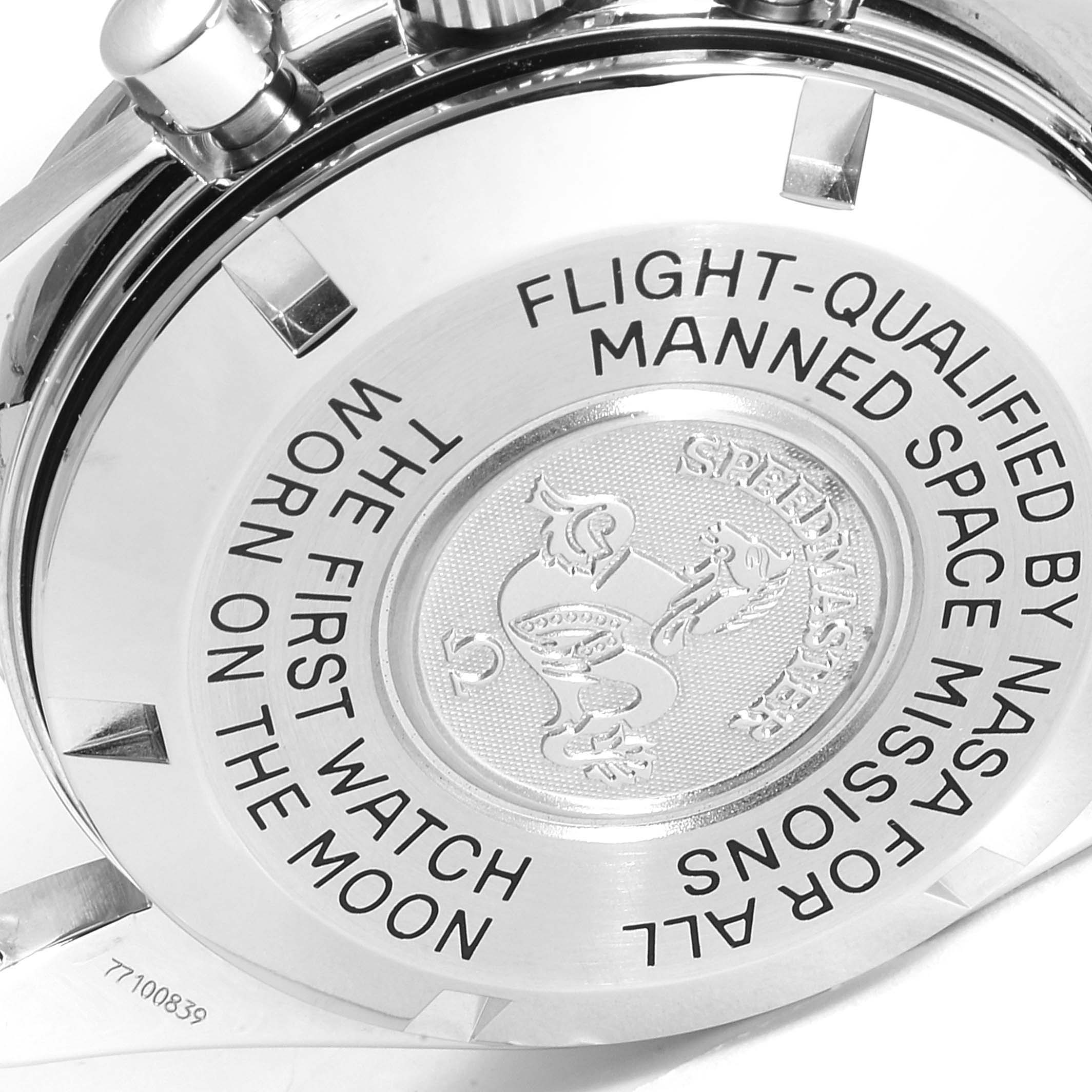 This image shows the case back of an Omega Speedmaster 3570.50.00 Men
s Stainless Steel Black Dial 3570.50.00 Men
s Stainless Steel Black Dial watch with engraved text and emblem.