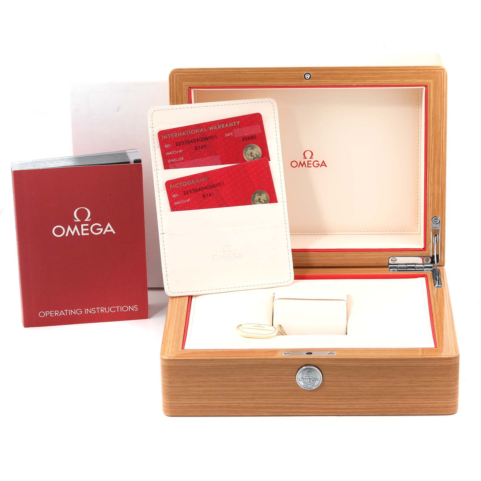 The image shows an Omega Speedmaster 323.30.40.40.06.001 Men's Stainless Steel Grey Dial 323.30.40.40.06.001 Men's Stainless Steel Grey Dial wooden watch box, warranty cards, and operating instructions.