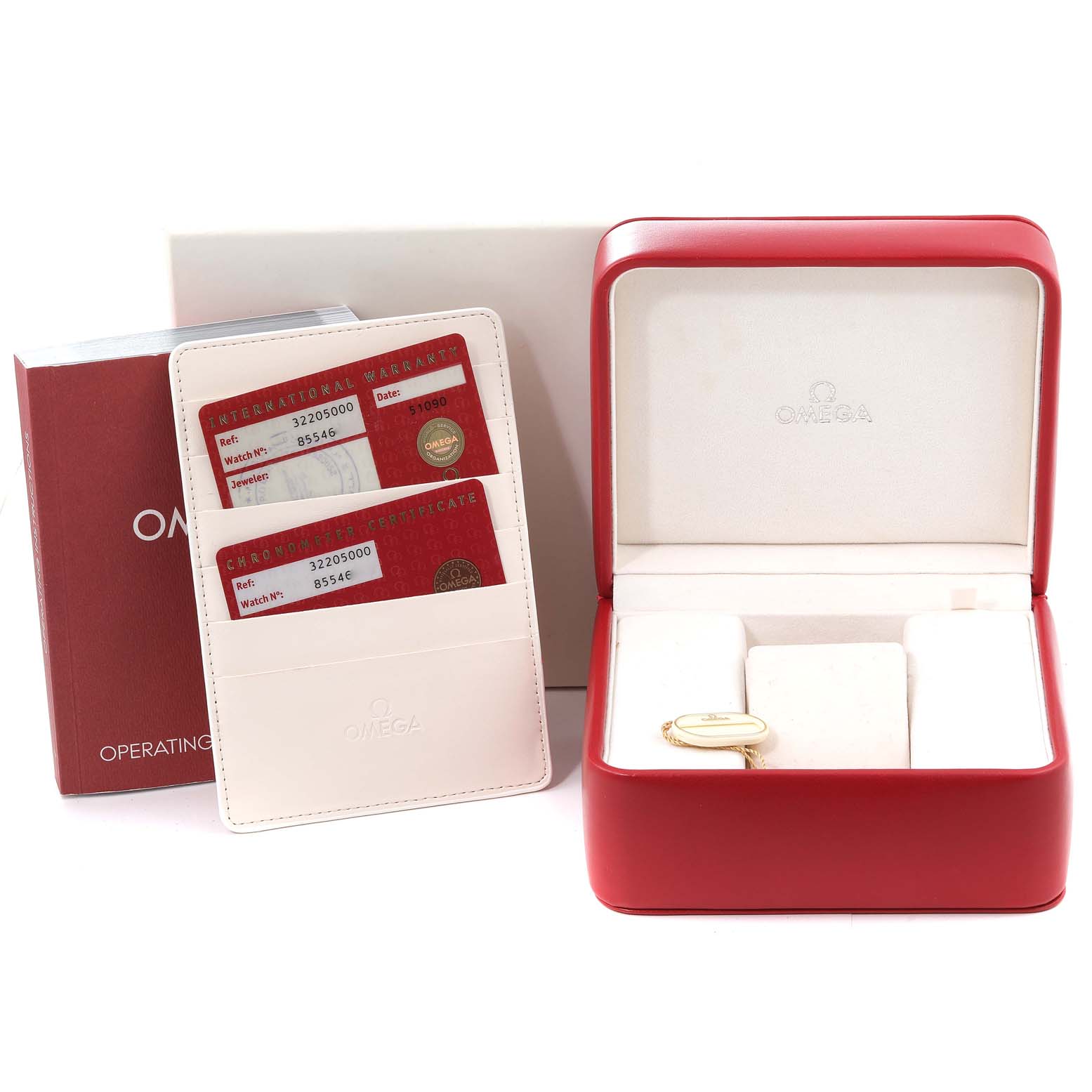 The image shows the packaging, warranty cards, and operating manual for an Omega Speedmaster 3220.50.00 Men's Stainless Steel Black Dial 3220.50.00 Men's Stainless Steel Black Dial watch.