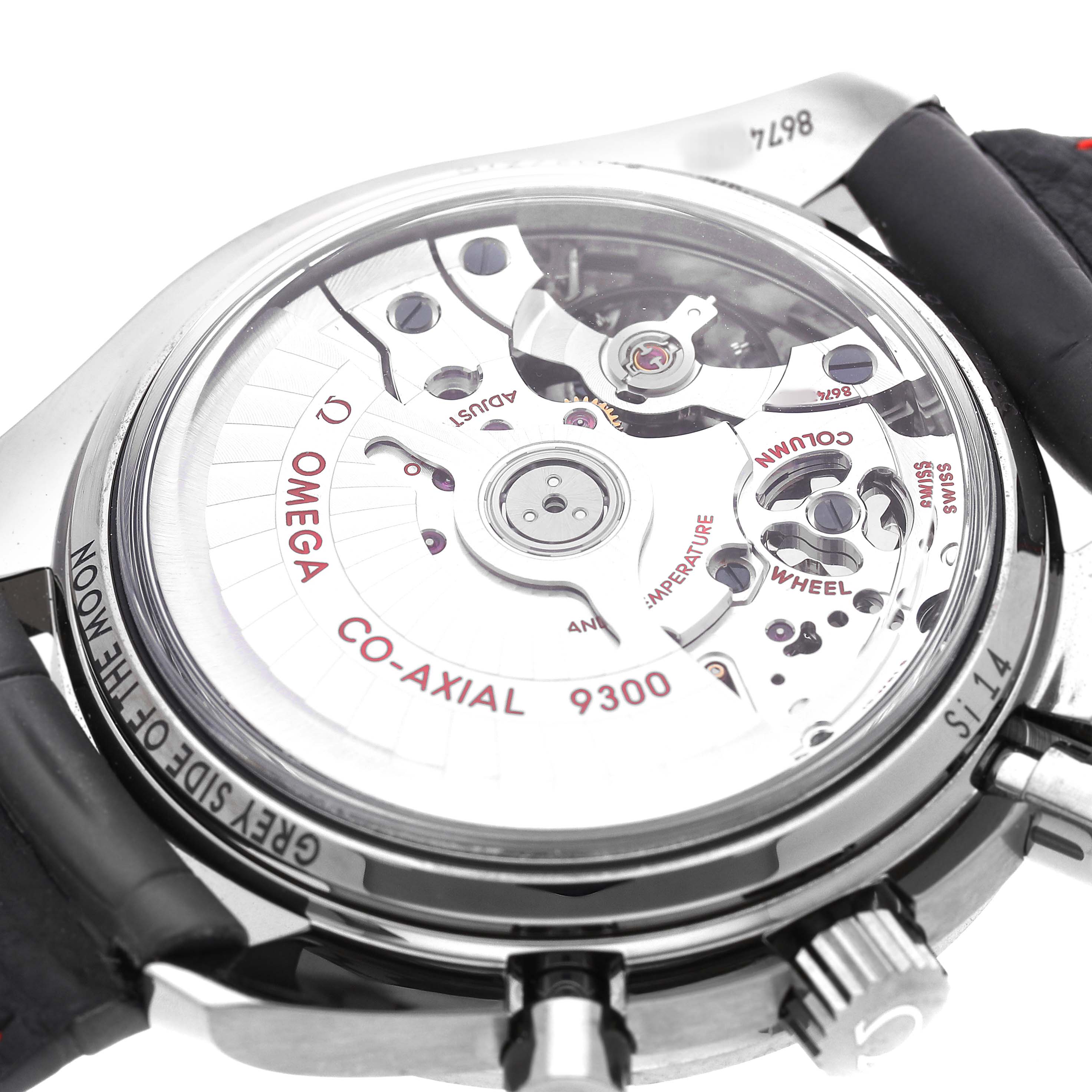 The image shows the backside of an Omega Speedmaster 311.93.44.51.99.002 Men's Ceramic Silver Dial, highlighting the Co-Axial 9300 movement through the transparent case back.