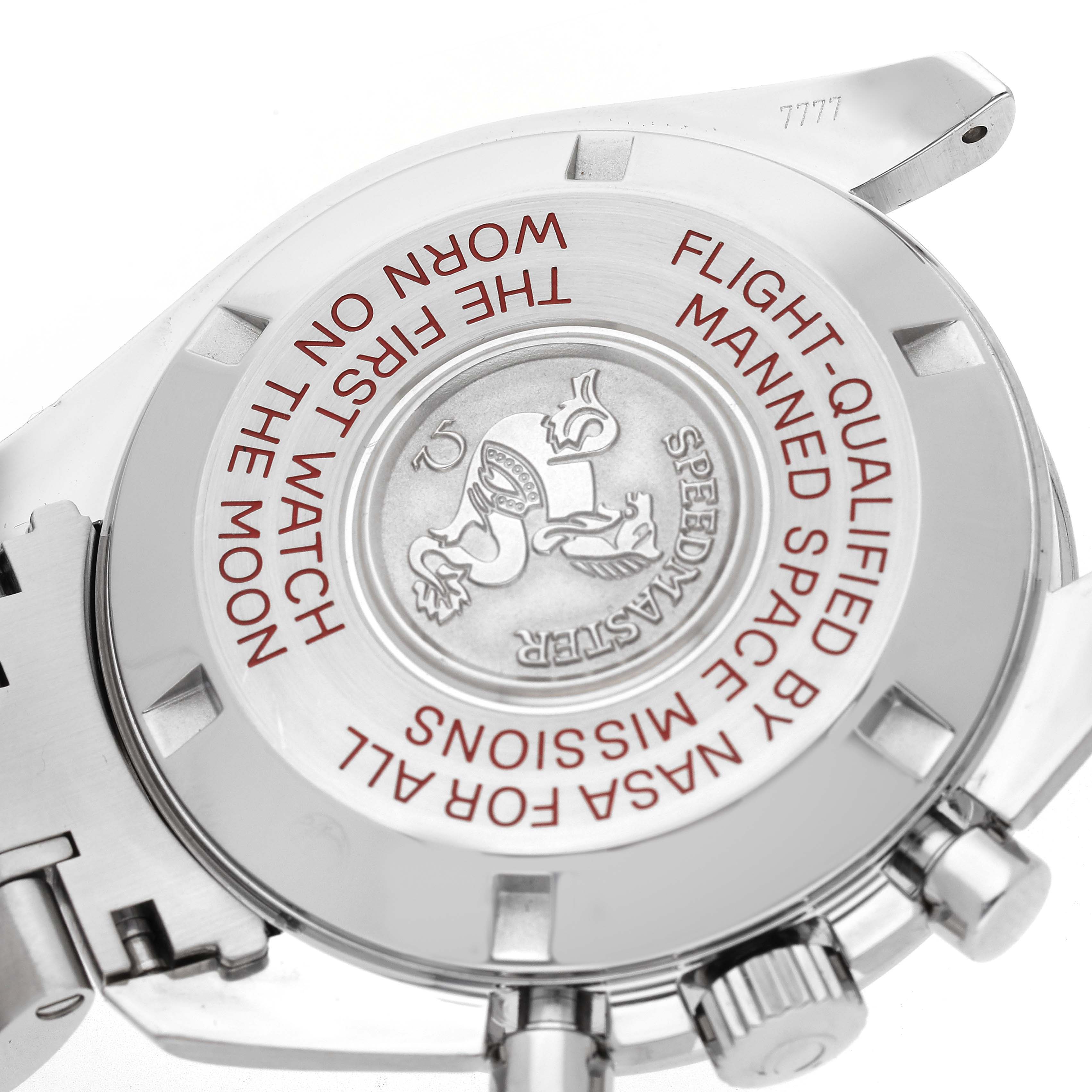 The image shows the back case of an Omega Speedmaster 311.30.42.30.01.004 Men
s Stainless Steel Black Dial 311.30.42.30.01.004 Men
s Stainless Steel Black Dial, including the engraved emblem and text.