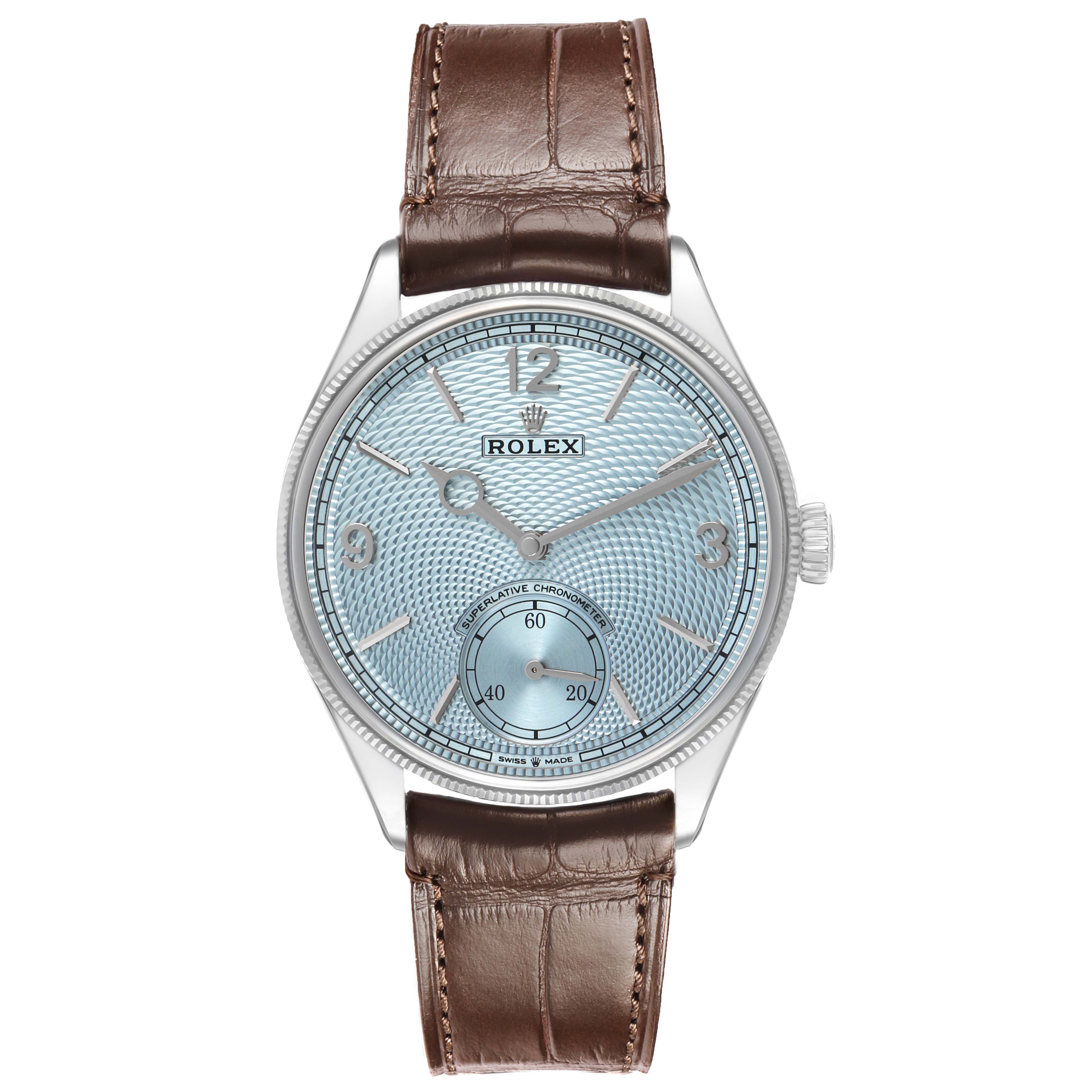The Rolex 1908 52506 Mens Platinum Blue Dial model watch is shown from a front angle, highlighting its dial, bezel, and brown leather strap.