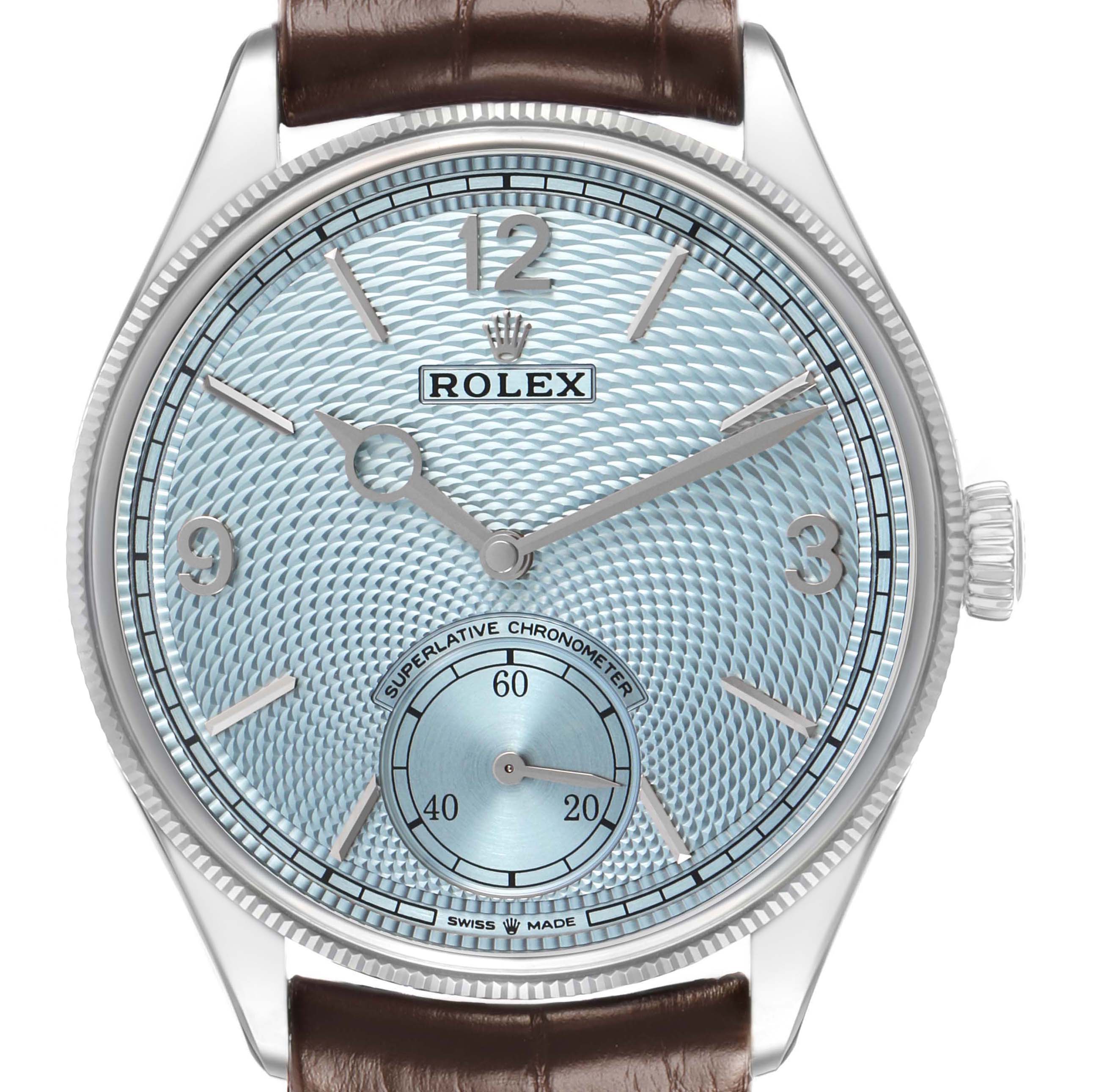 The Rolex 1908 52506 Mens Platinum Blue Dial model is shown from the front, highlighting its dial, hands, and crown with a brown leather strap.
