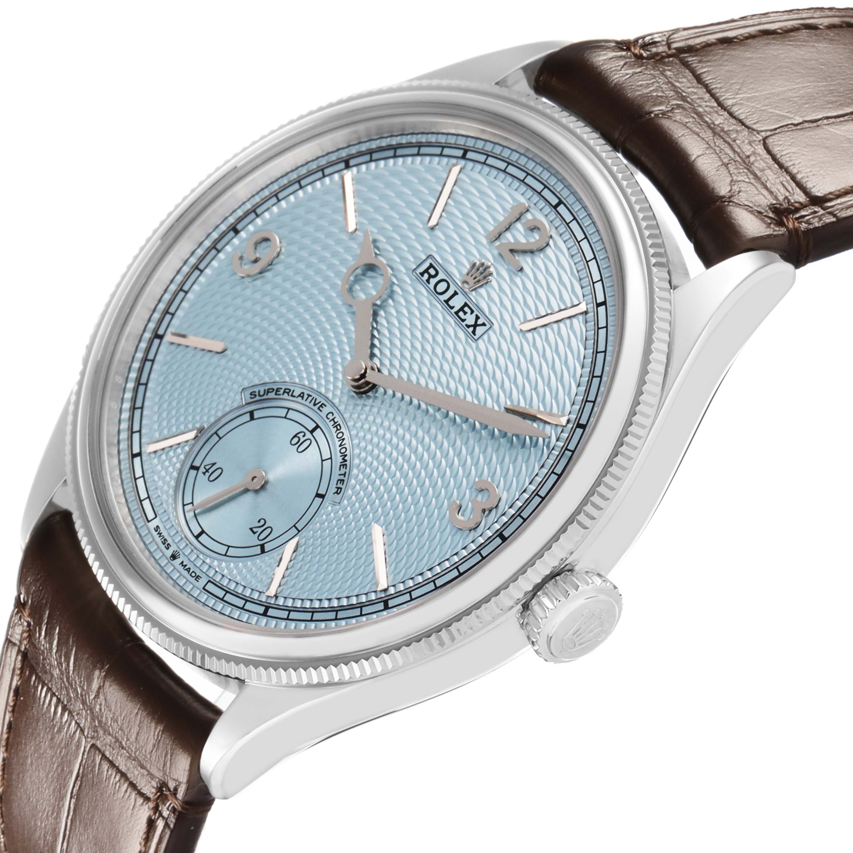 The Rolex 1908 52506 Men's Platinum Blue Dial watch is shown in a three-quarter angle, highlighting its blue dial, silver numerals, and brown leather strap.