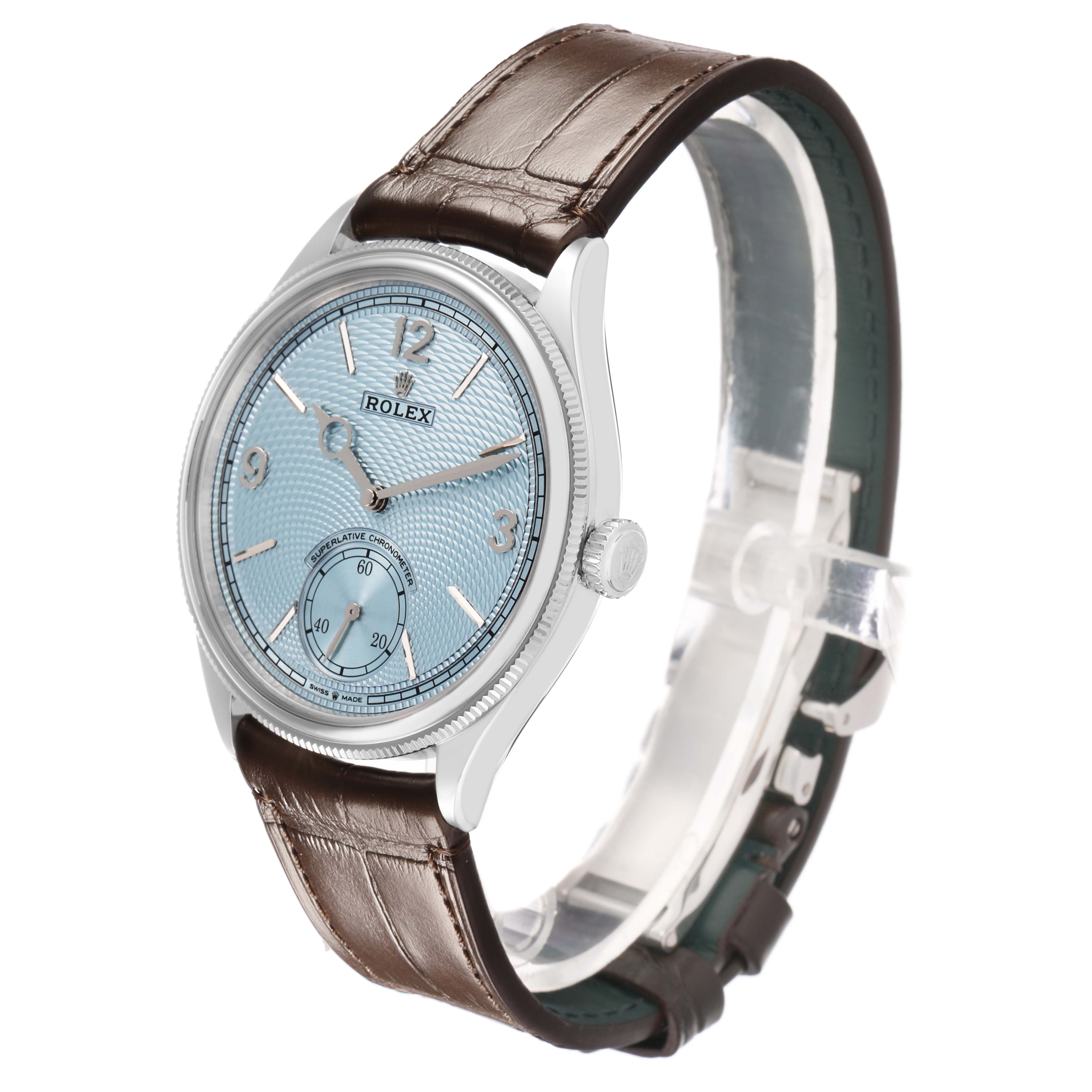 The Rolex 1908 52506 Men's Platinum Blue Dial model watch is shown at a three-quarter angle, displaying its face, side, and leather strap.