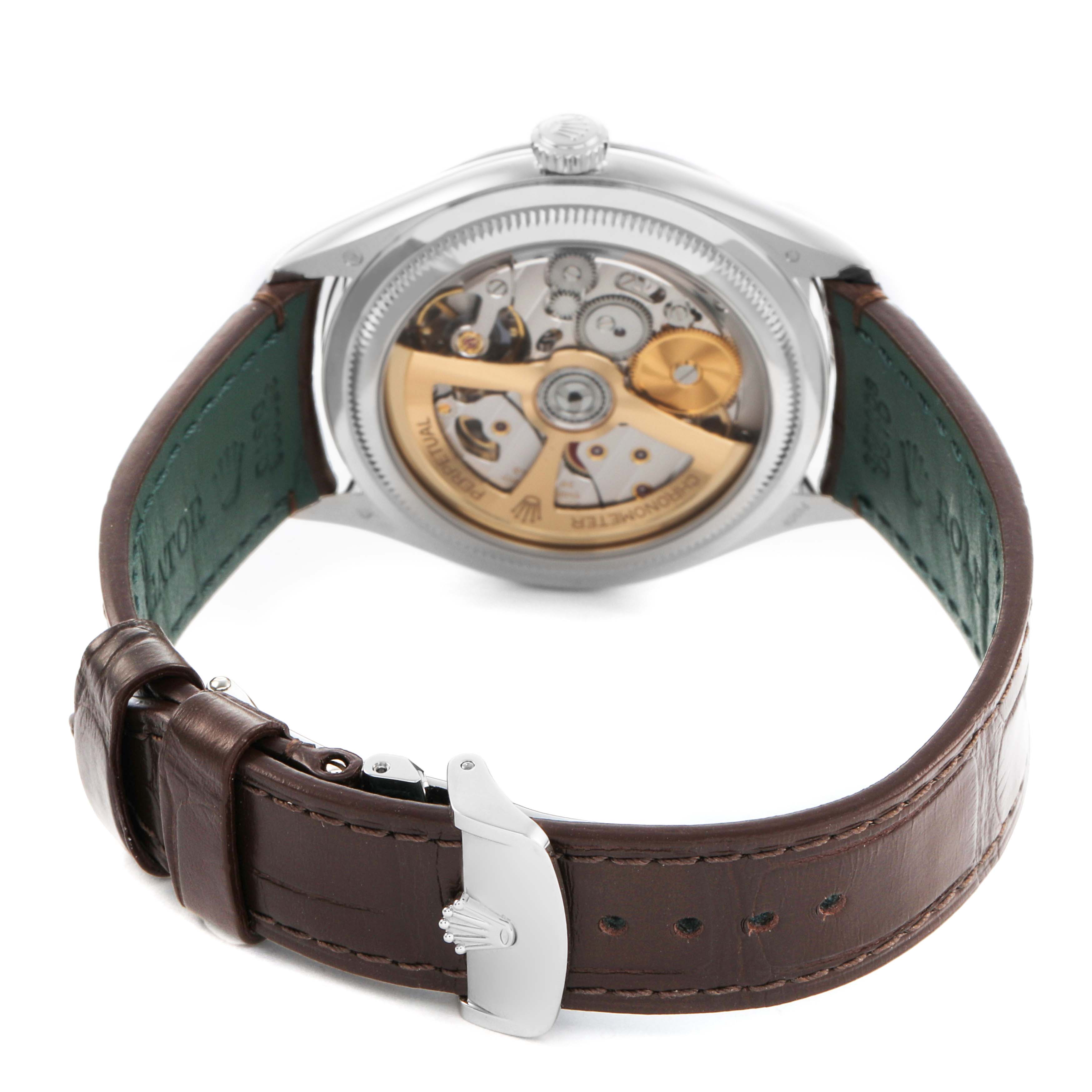 The image shows the back view of the Rolex 1908 52506 Men's Platinum Blue Dial model, highlighting its movement and leather strap.
