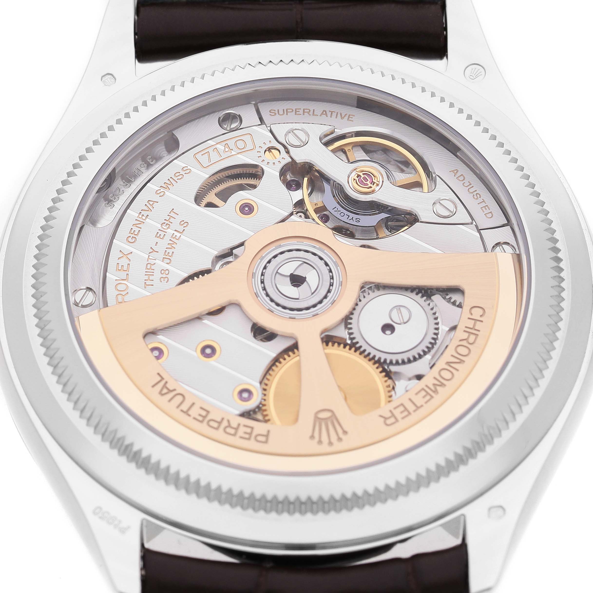 The Rolex 1908 52506 Men's Platinum Blue Dial model is shown from the back, revealing its intricate movement and rotor.