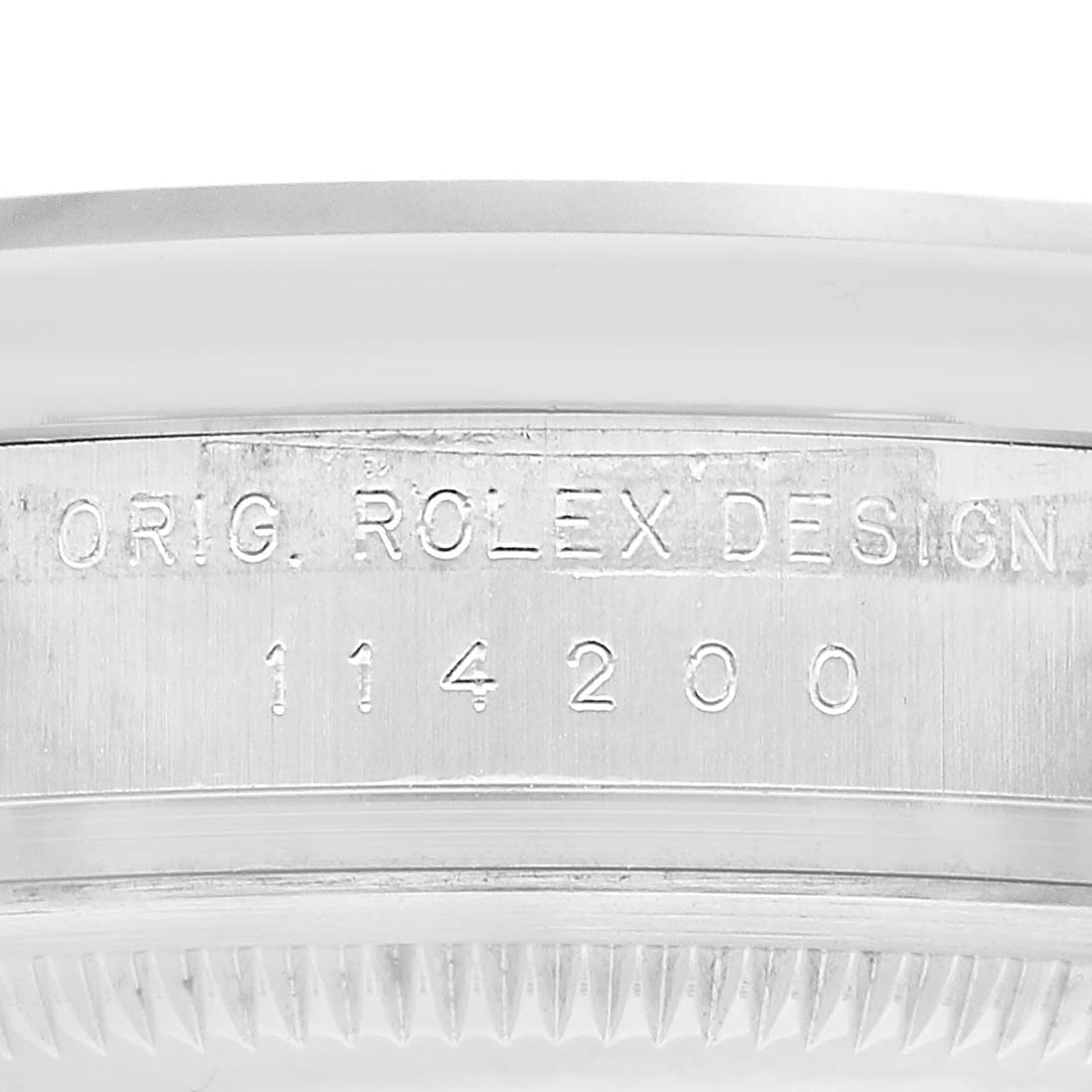 The image shows a close-up angle of the case side of a Rolex Air-King 114200 Men's Stainless Steel Silver Dial, displaying the model number and “ORIG. ROLEX DESIGN” engraving.