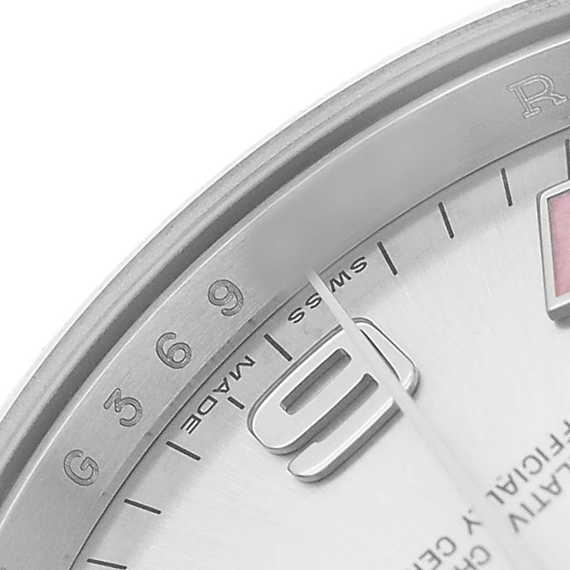 The image shows a close-up of the Rolex Air-King 114200 Men's Stainless Steel Silver Dial watch dial, featuring hour markers and part of the second hand.