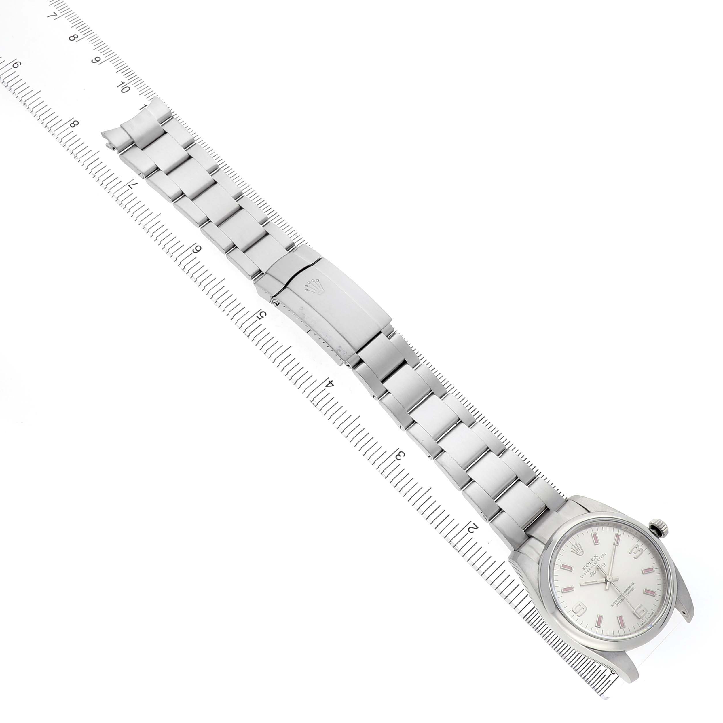 The Rolex Air-King 114200 Men's Stainless Steel Silver Dial watch is shown from a top-down angle, highlighting the bracelet, clasp, and dial.