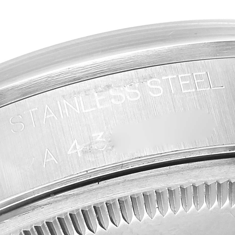 This close-up image shows the engraved stainless steel casing of a Rolex Air-King 14000 Men's Stainless Steel Blue Dial 14000 Men's Stainless Steel Blue Dial watch.