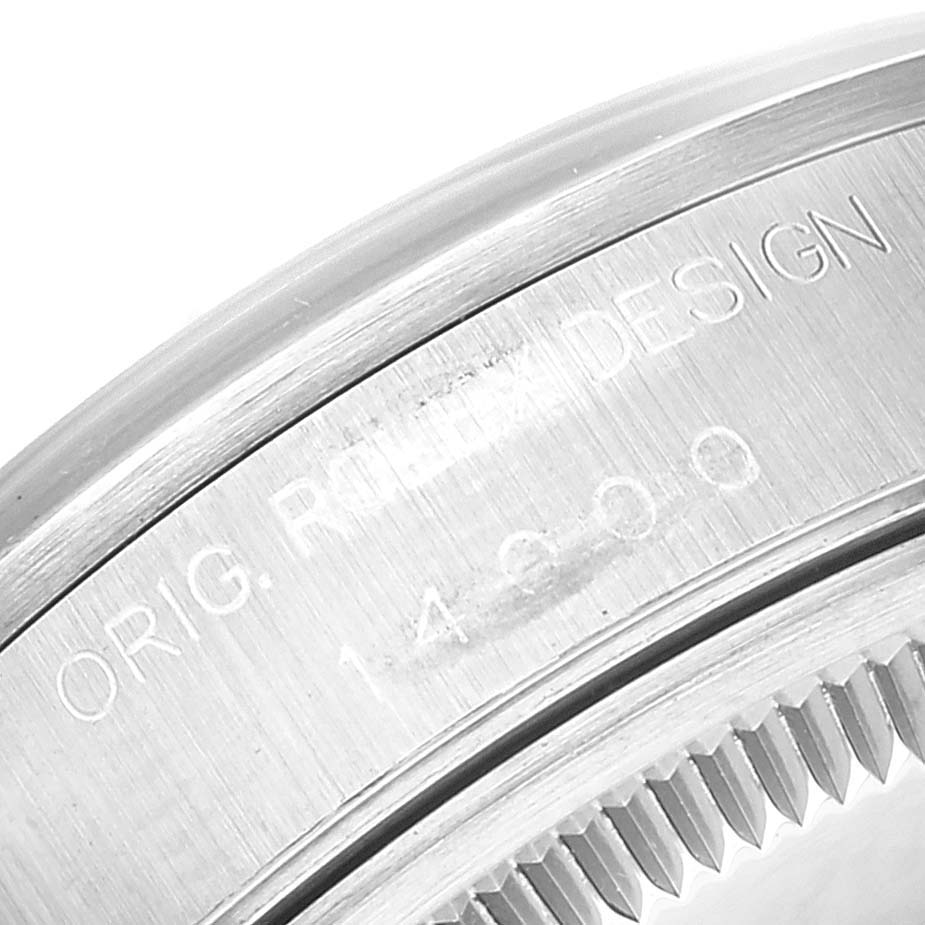 Close-up of the Rolex Air-King 14000 Men's Stainless Steel Blue Dial 14000 Men's Stainless Steel Blue Dial model's engraved bezel edge, showing the "Orig. Rolex Design" and model number 14000.