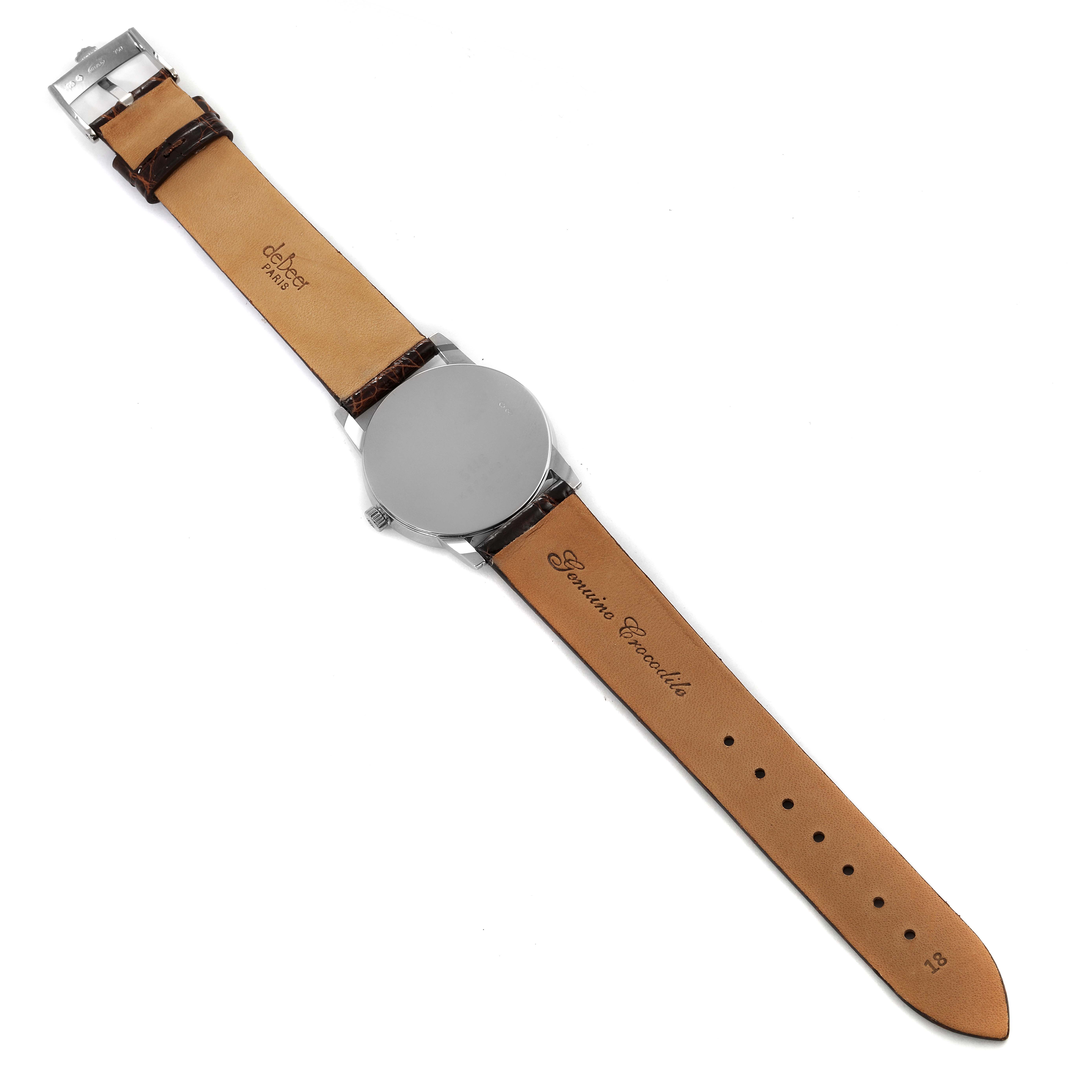 This image shows the back of a Rolex Cellini 5116 Men's White Gold Black Dial 5116 Men's White Gold Black Dial watch laid flat, displaying the leather strap's inner side and the case back.