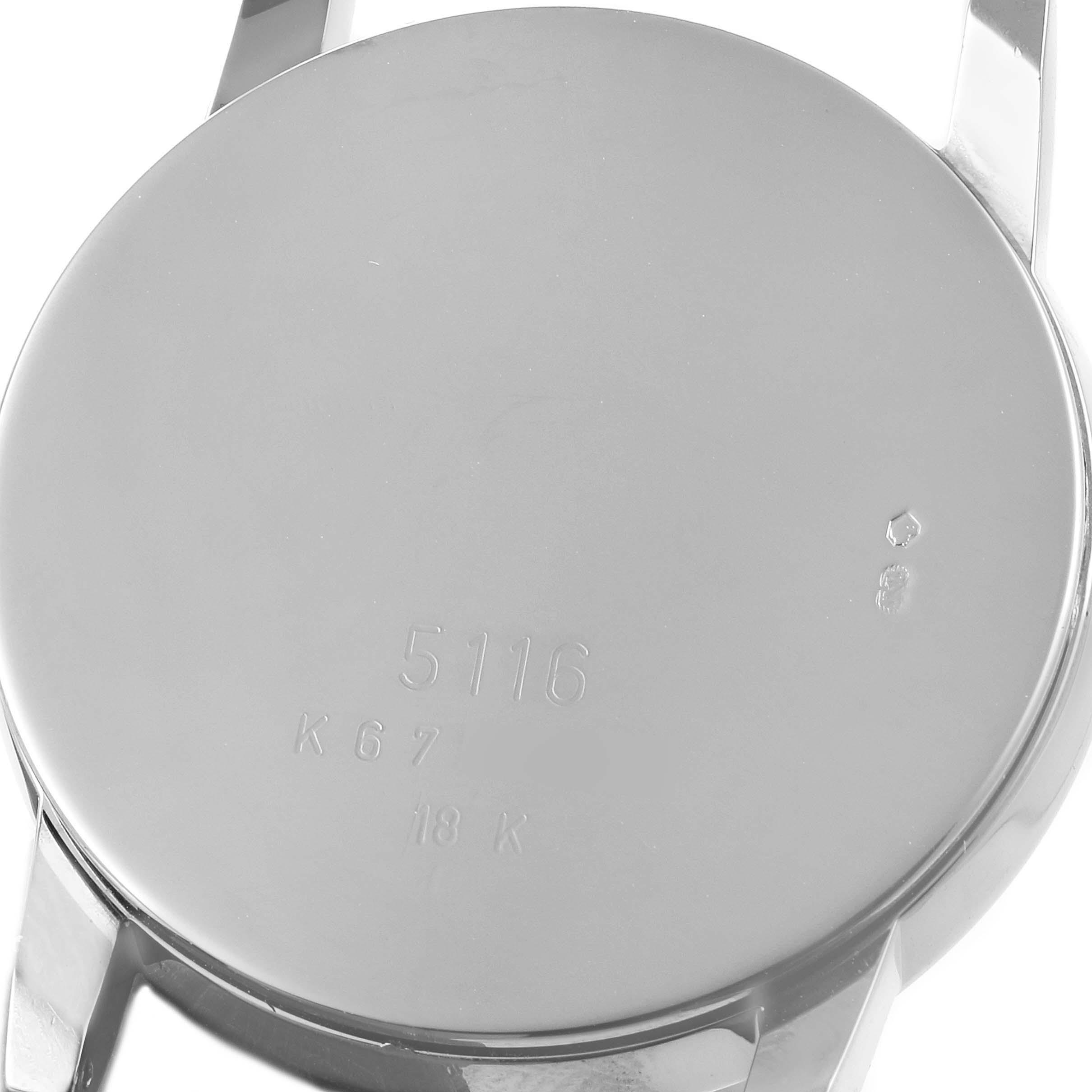 This image shows the back case of the Rolex Cellini 5116 Men's White Gold Black Dial 5116 Men's White Gold Black Dial watch from a straight-on angle, showcasing its engravings and lugs.