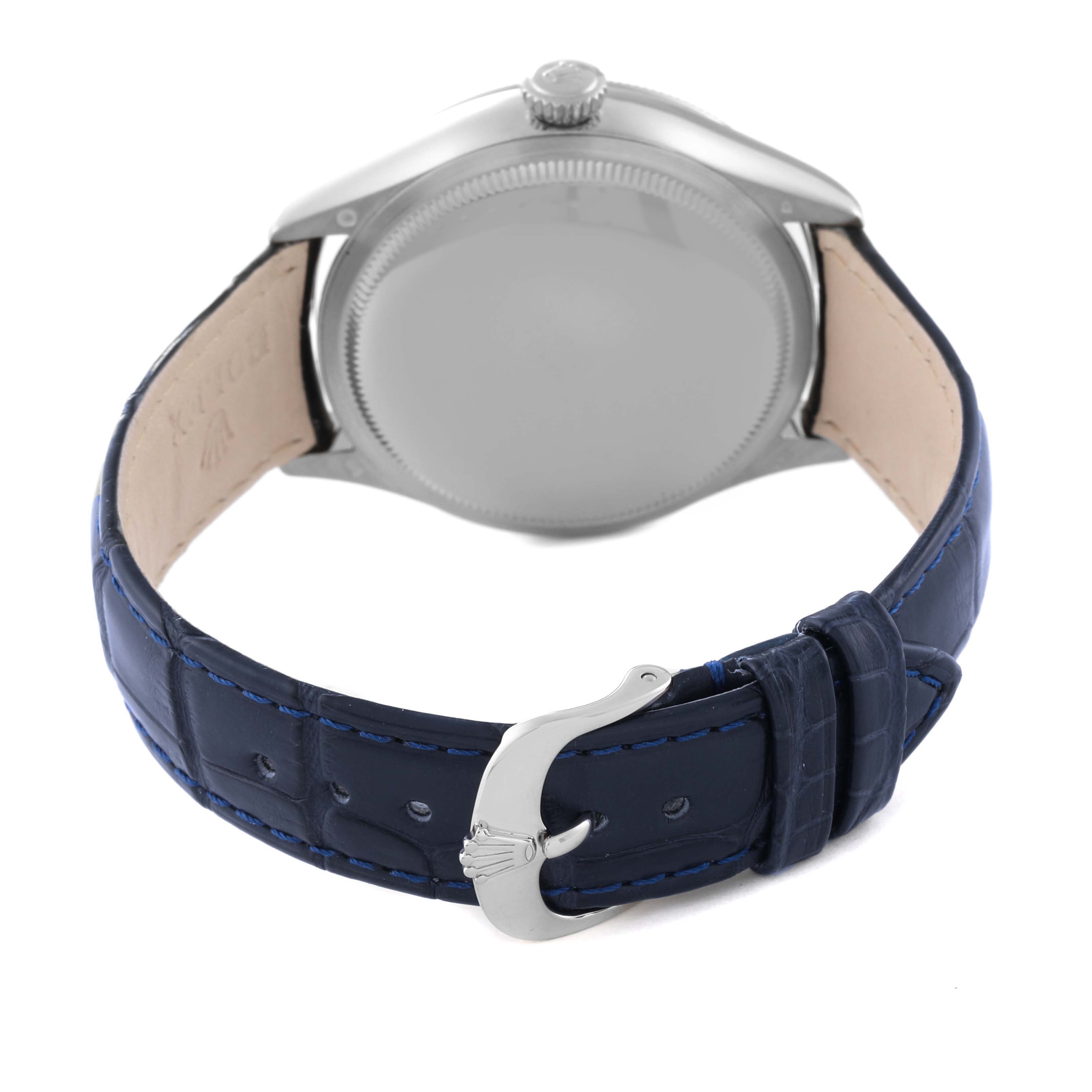 The image shows the back view of a Rolex Cellini 50519 Men
s White Gold Blue Dial 50519 Men
s White Gold Blue Dial watch featuring the case back and blue leather strap with a buckle.