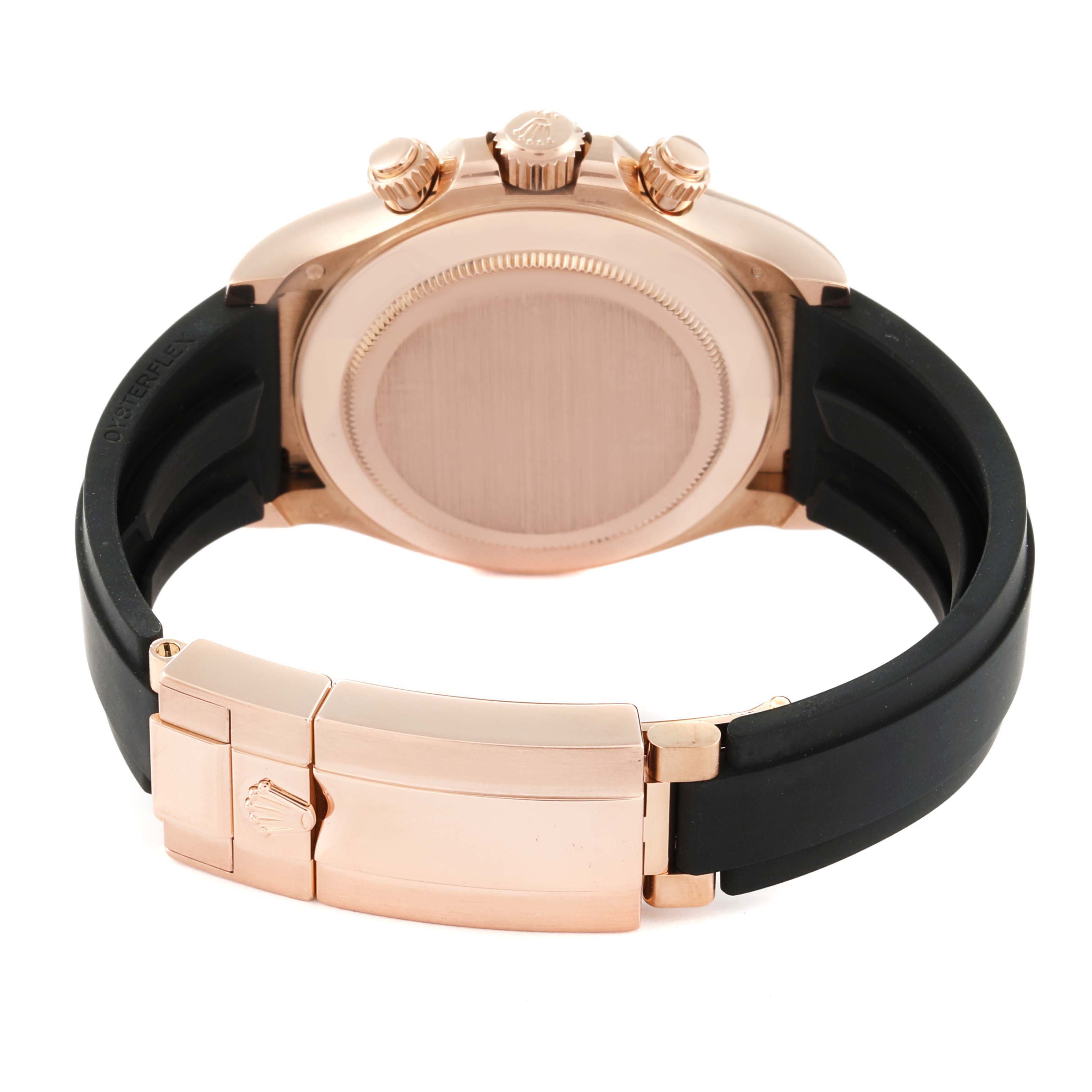 This image shows the back of a Rolex Daytona 116515LN Men's Rose Gold Black Dial 116515LN Men's Rose Gold Black Dial watch, focusing on the case, crown, and clasp with a black strap.