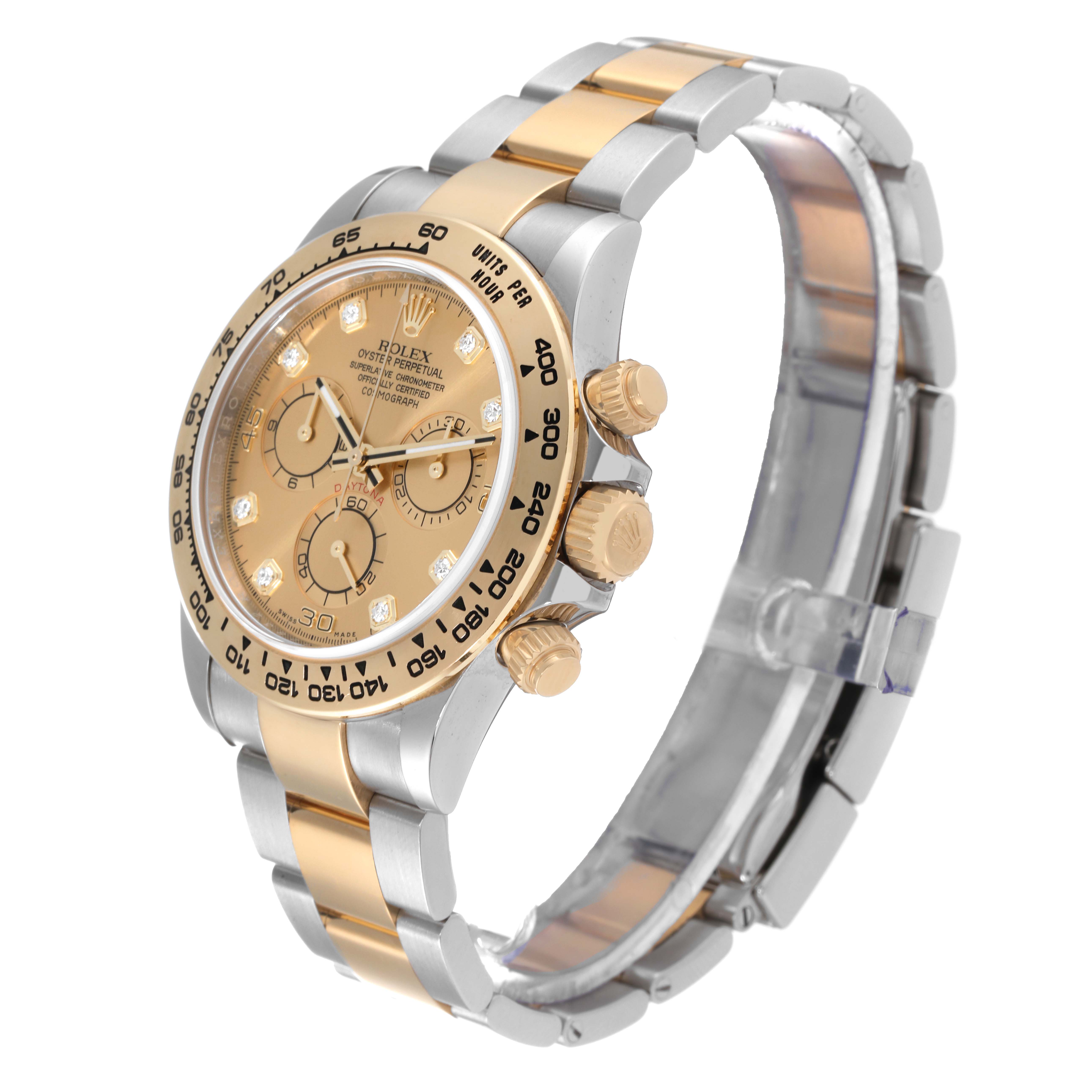 The image shows a Rolex Daytona 116503 Men's Steel and Gold (two tone) Champagne Dial 116503 Men's Steel and Gold (two tone) Champagne Dial watch from a side angle, displaying its gold and silver band, bezel, and face with chronograph dials.