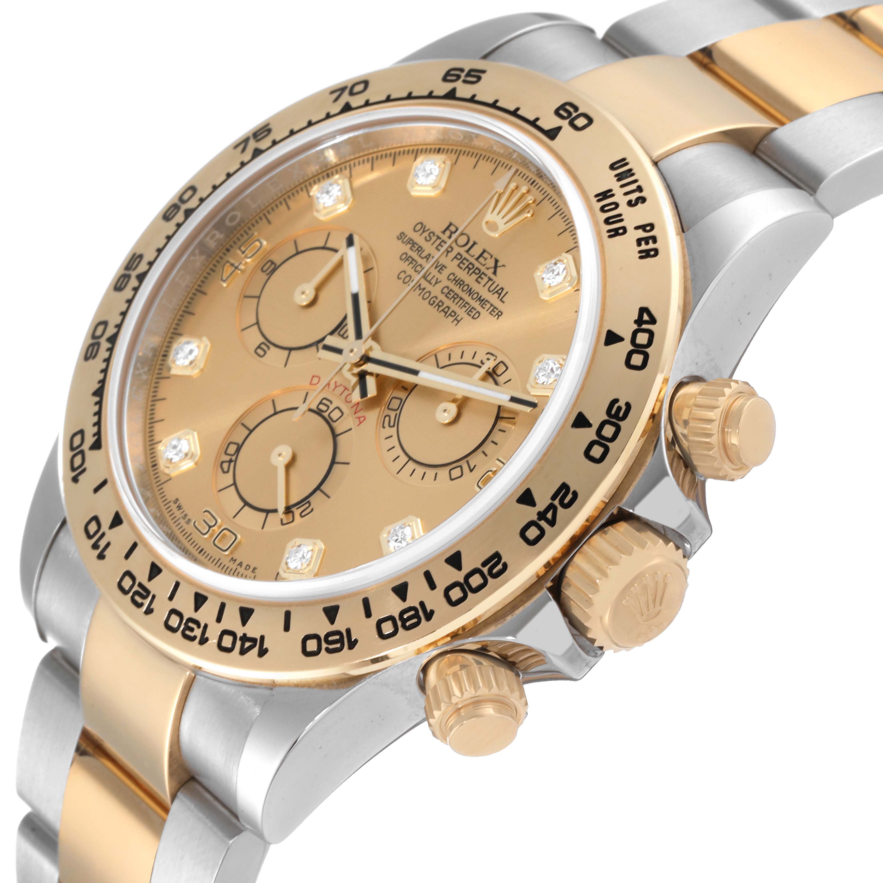 This image shows a close-up angle of the face and side of a Rolex Daytona 116503 Men's Steel and Gold (two tone) Champagne Dial 116503 Men's Steel and Gold (two tone) Champagne Dial watch, capturing its bezel, dial, and crown.