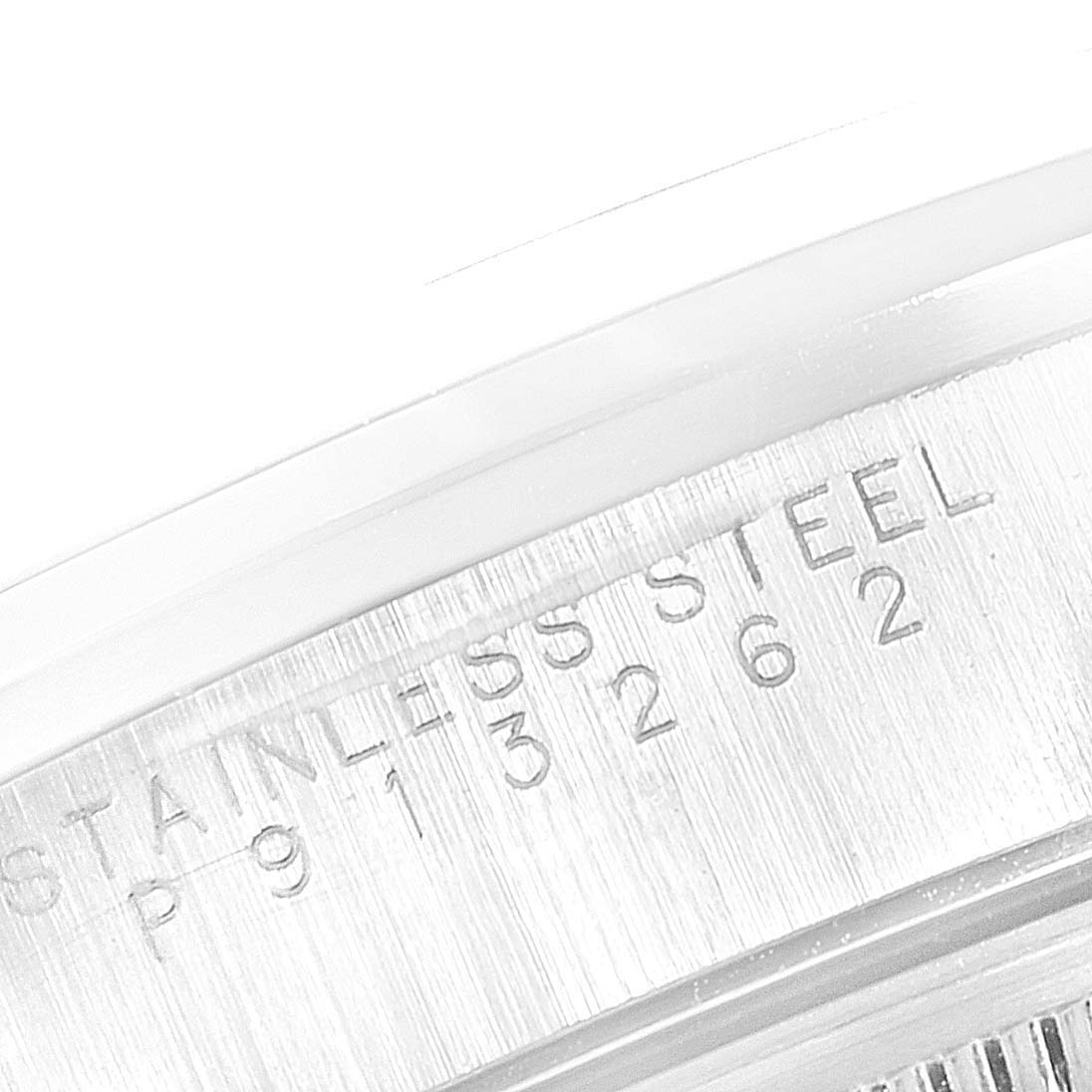 The image shows a close-up of the serial number engraved on the stainless steel part of a Rolex Date 15200 Men's Stainless Steel Blue Dial 15200 Men's Stainless Steel Blue Dial watch.