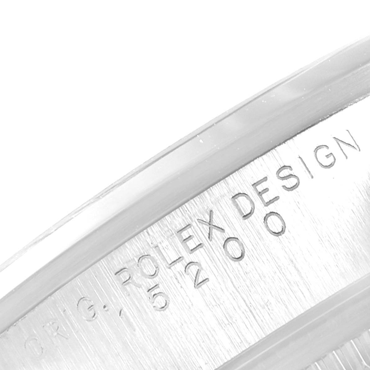 The image shows a close-up of the engraved side of the case of a Rolex Date 15200 Men's Stainless Steel Blue Dial 15200 Men's Stainless Steel Blue Dial model watch.