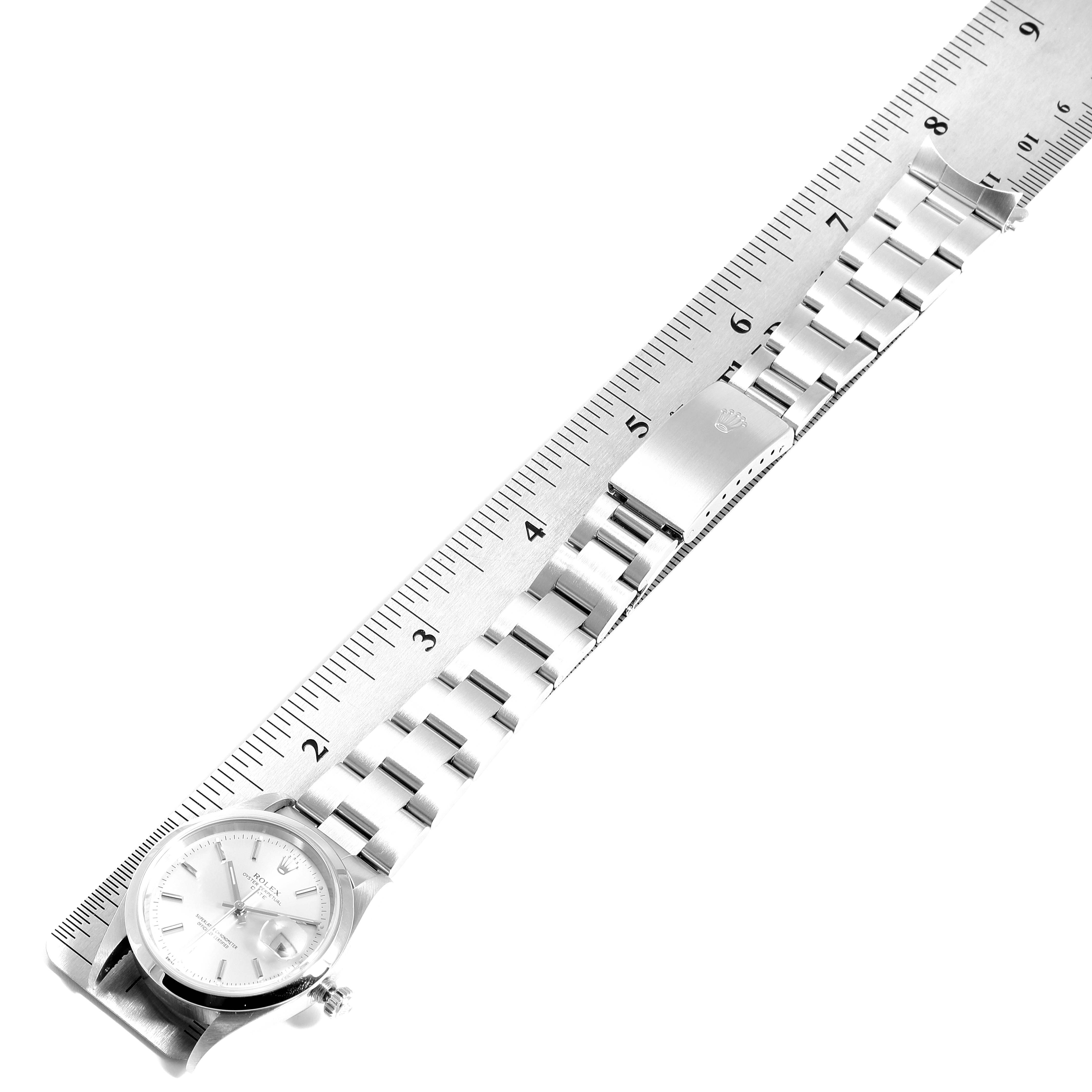 The image shows a Rolex Datejust 15200 Men's Stainless Steel Silver Dial 15200 Men's Stainless Steel Silver Dial watch laid flat with a metal bracelet next to a ruler for measurement.