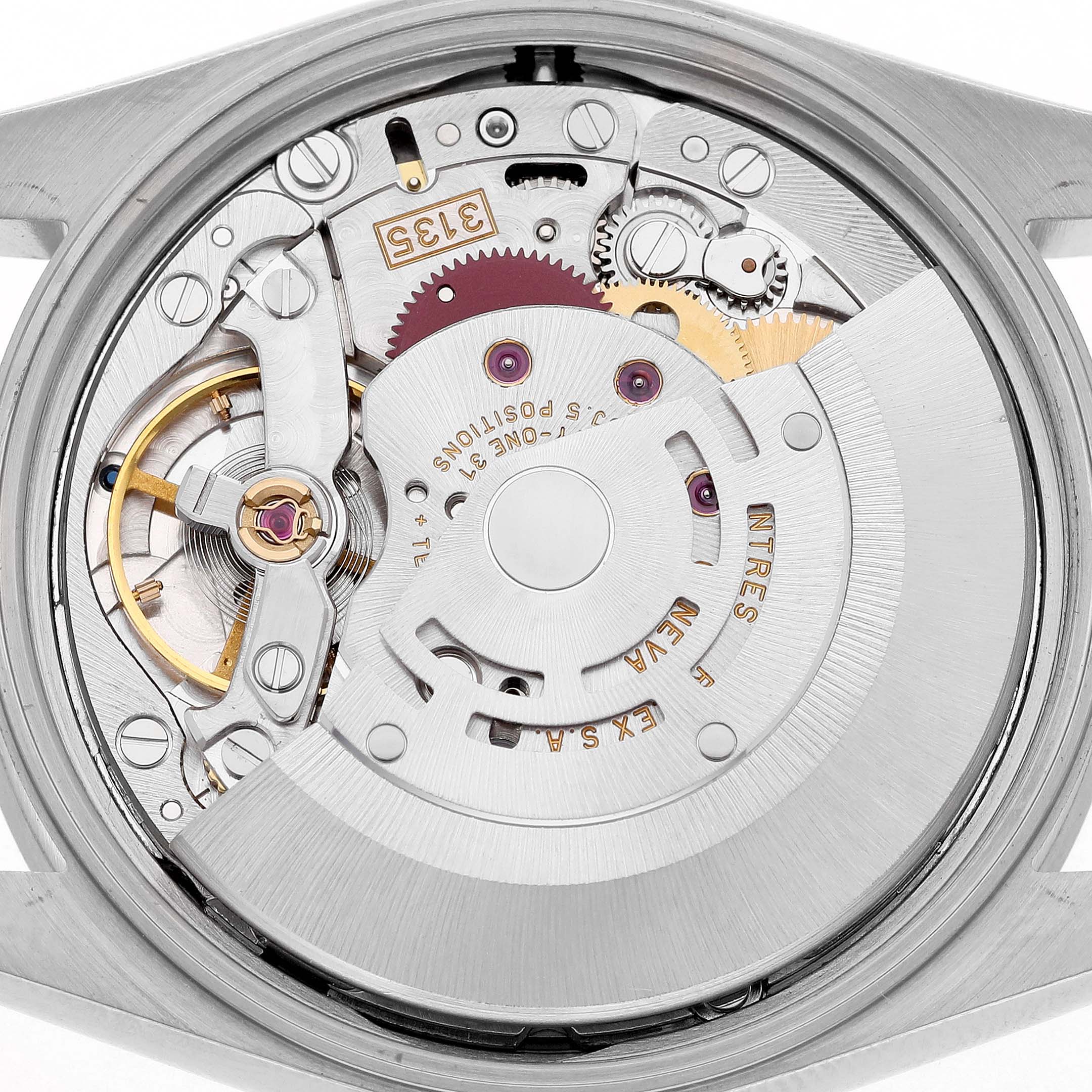 The image shows the movement of a Rolex Date 15210 Men's Stainless Steel Black Dial model, focusing on its intricate internal mechanism parts.