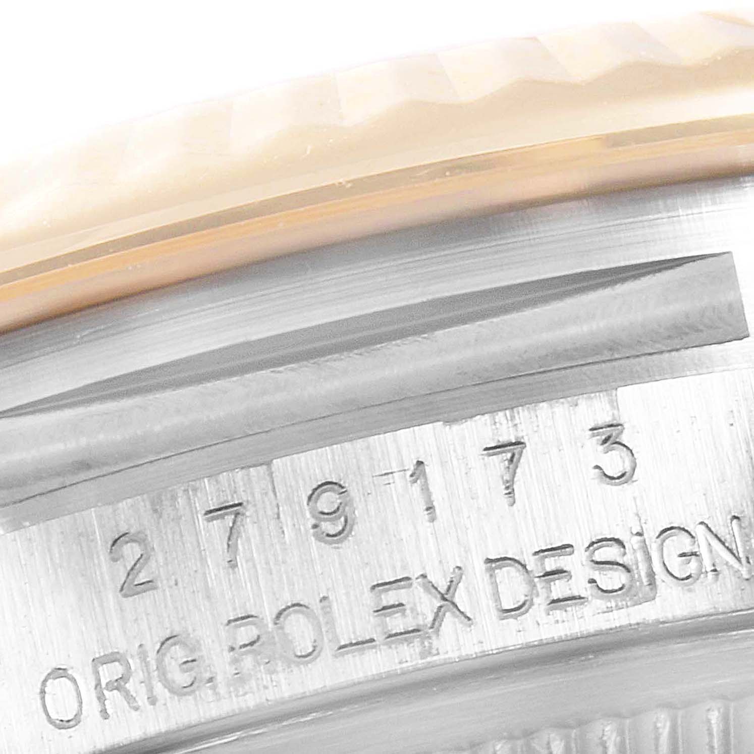 This close-up shows the serial number and "ORIG ROLEX DESIGN" inscription on a Rolex Datejust 279173 Women's Steel and Gold (two tone) Green Dial 279173 Women's Steel and Gold (two tone) Green Dial model.