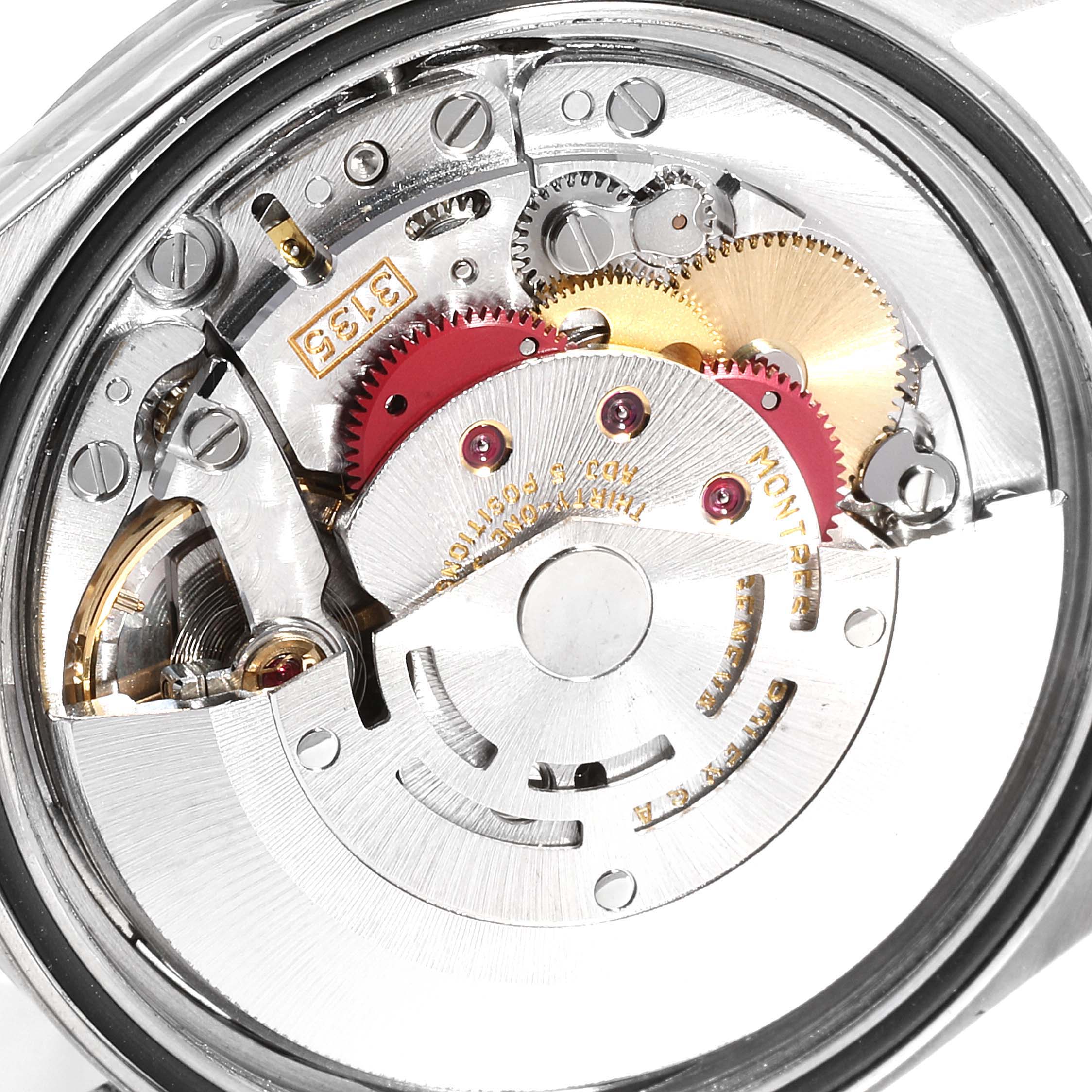 The image shows the intricate inner workings and movements of the Rolex Datejust 16200 Men's Stainless Steel Silver Dial 16200 Men's Stainless Steel Silver Dial watch from a close-up, back view angle.