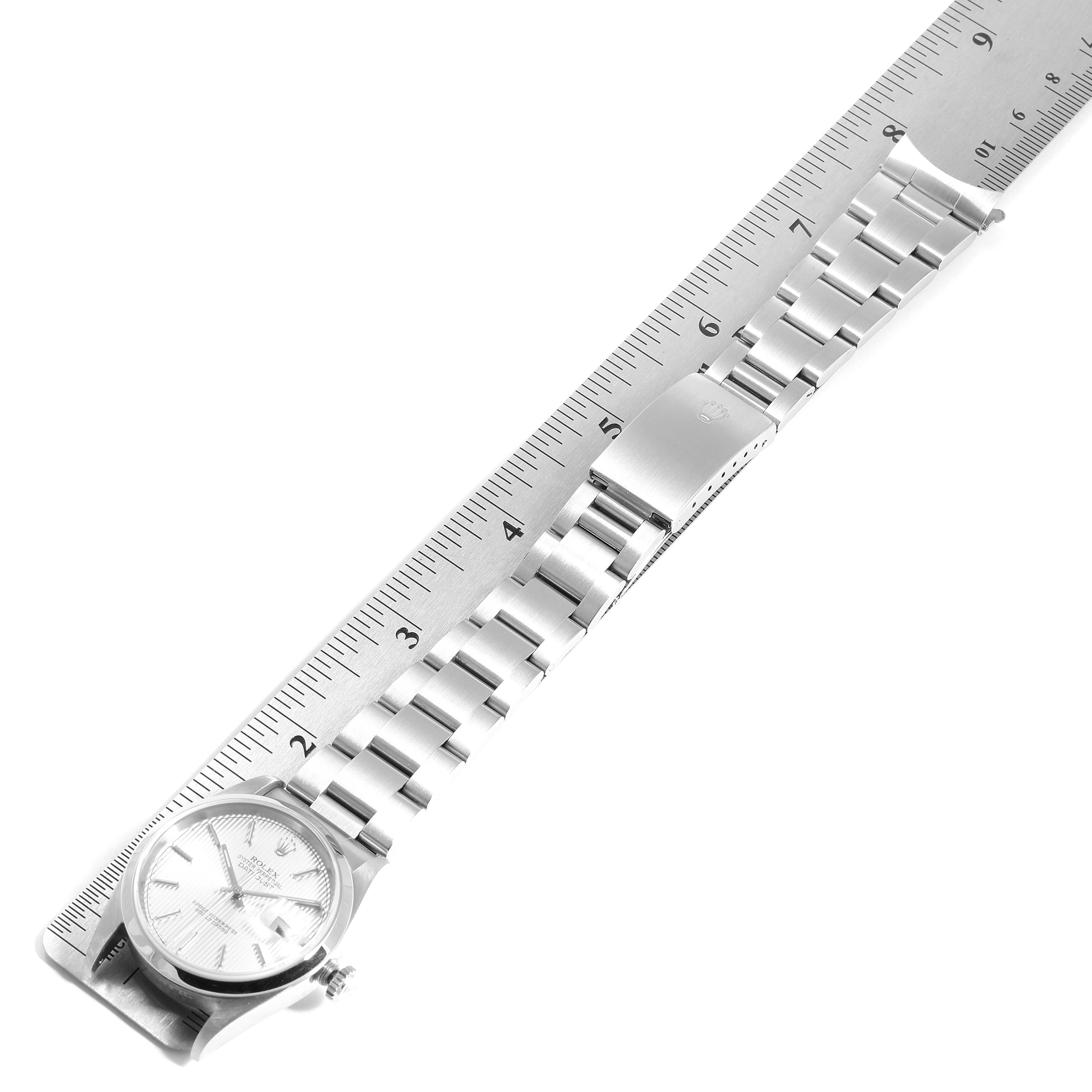 The image shows a Rolex Datejust 16200 Men's Stainless Steel Silver Dial 16200 Men's Stainless Steel Silver Dial watch laid flat on a ruler, featuring the dial, bracelet, and clasp.