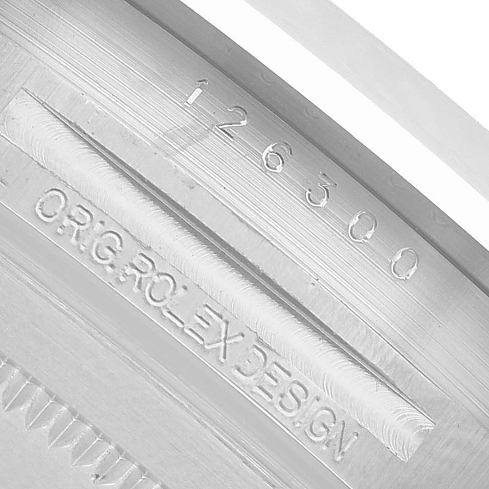 The image shows the case side engraving of a Rolex Datejust 41 126300 Men's Stainless Steel Blue Dial, displaying its reference and design details.