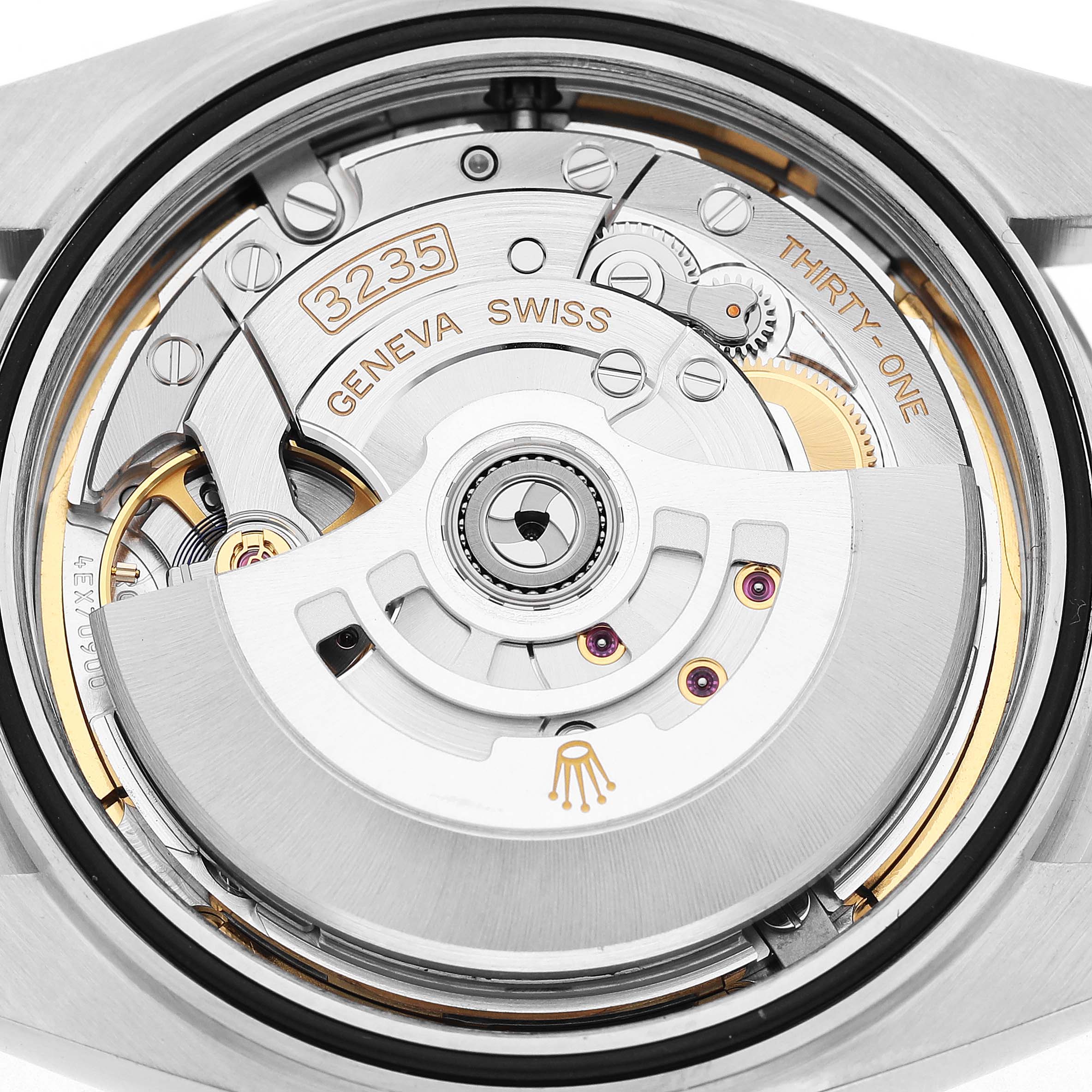 The image shows the mechanical movement from the back of a Rolex Datejust 41 126300 Men's Stainless Steel Blue Dial watch, highlighting the rotor and gears.
