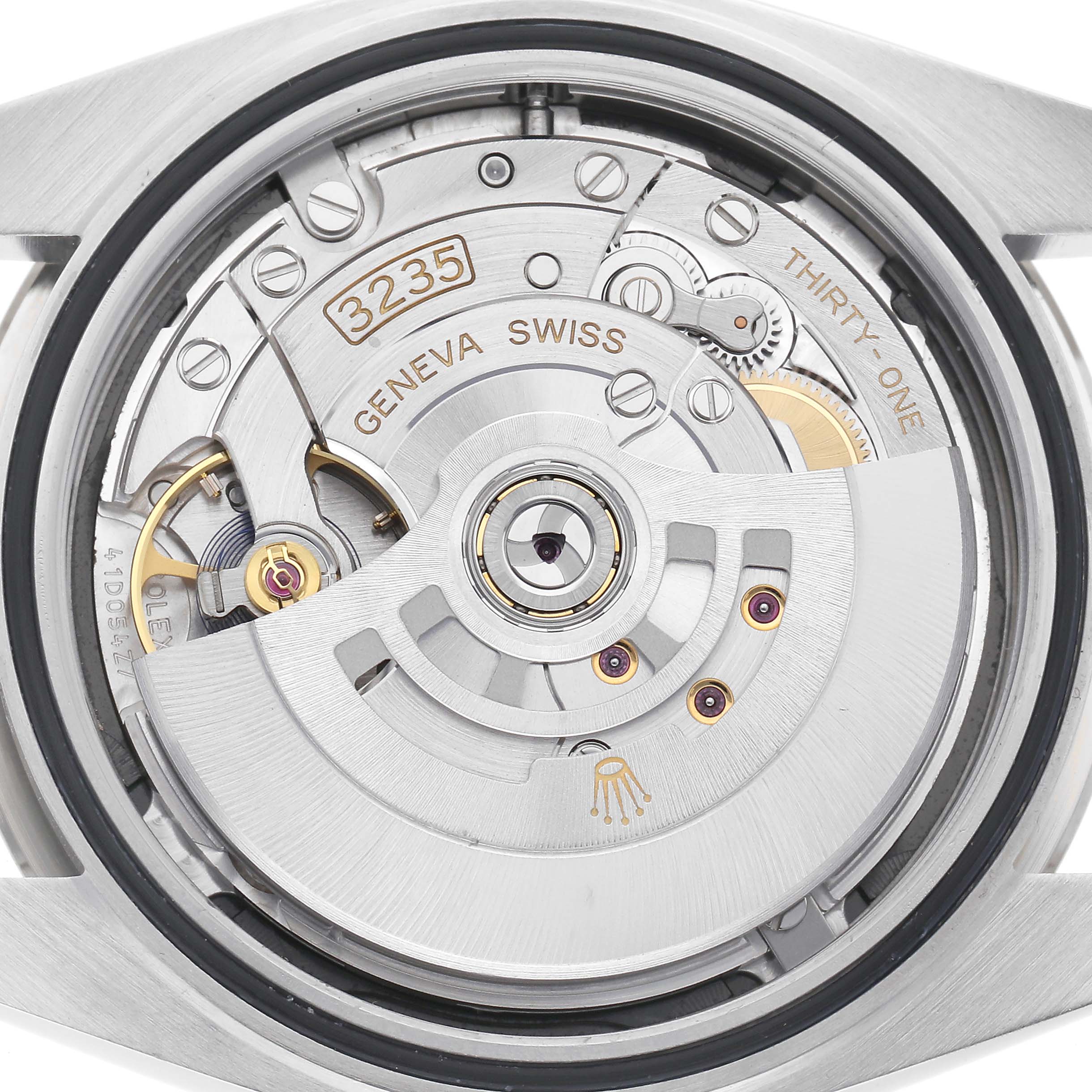 The image shows the movement of a Rolex Datejust watch, featuring the Geneva Swiss marking and intricate mechanical details.