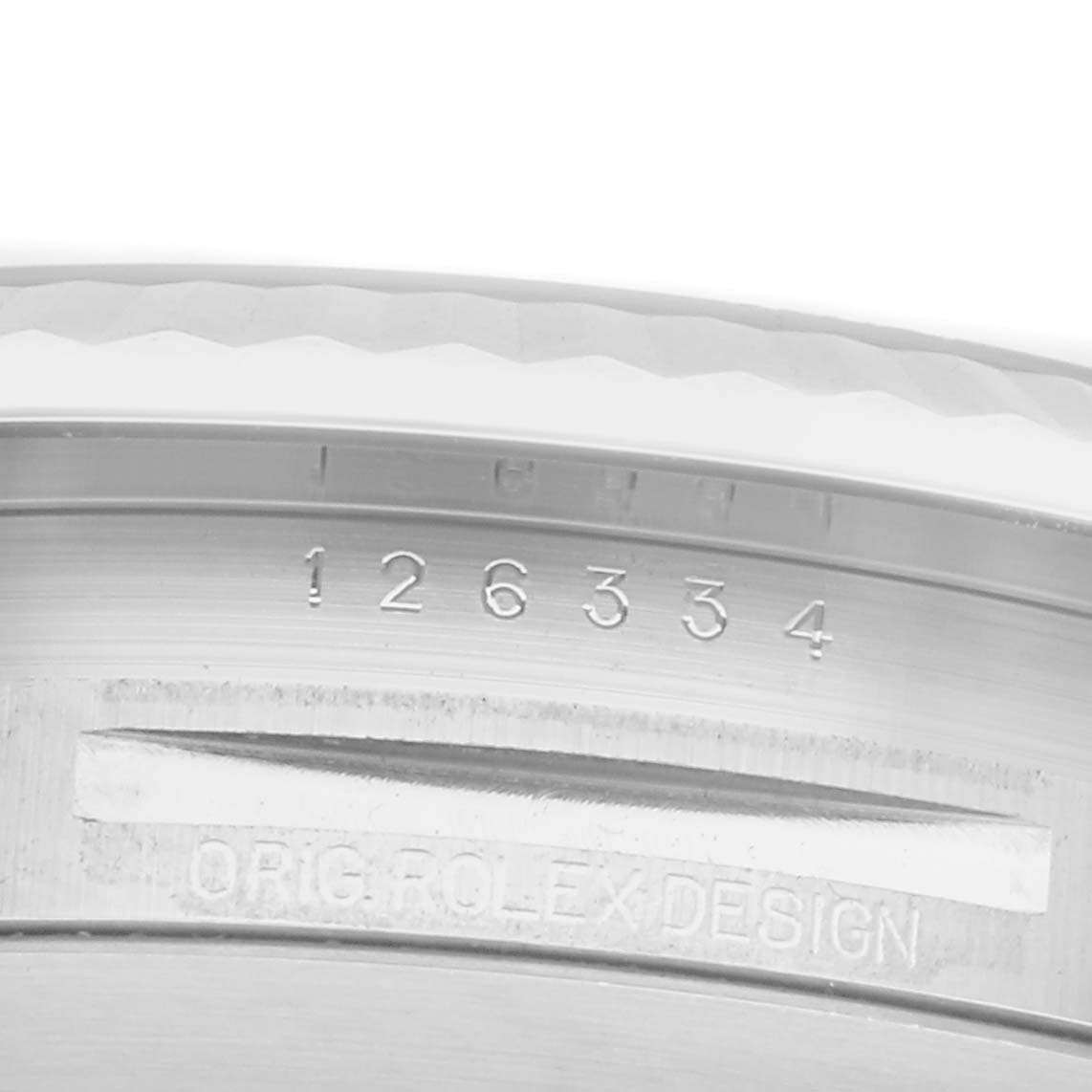 The image shows a close-up of the Rolex Datejust model
s case side with its engraved serial and model numbers.