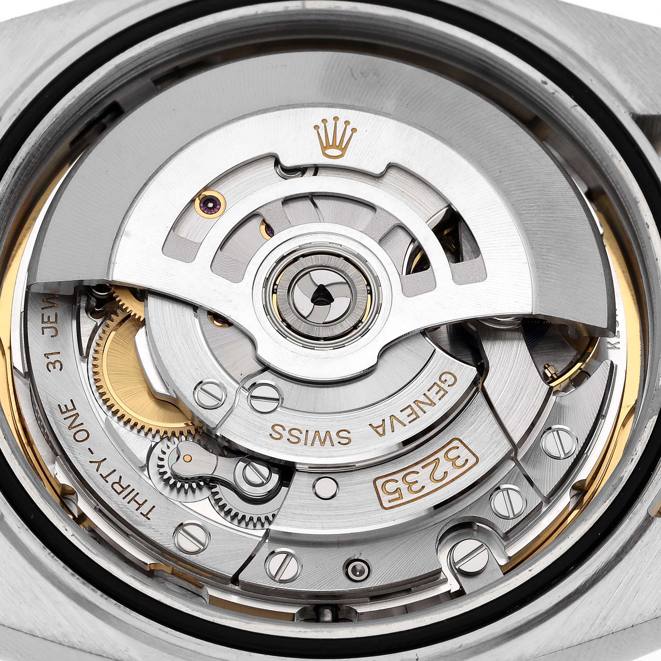 This image shows a close-up view of the movement inside a Rolex Datejust 41 126303 Men's Steel and Gold (two tone) Mother of Pearl Dial 126303 Men's Steel and Gold (two tone) Mother of Pearl Dial watch.