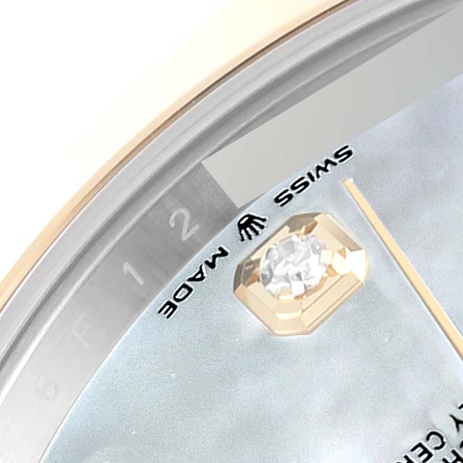 This close-up image shows the bezel, part of the dial, and diamond minute marker of a Rolex Datejust 41 126303 Men's Steel and Gold (two tone) Mother of Pearl Dial 126303 Men's Steel and Gold (two tone) Mother of Pearl Dial watch.