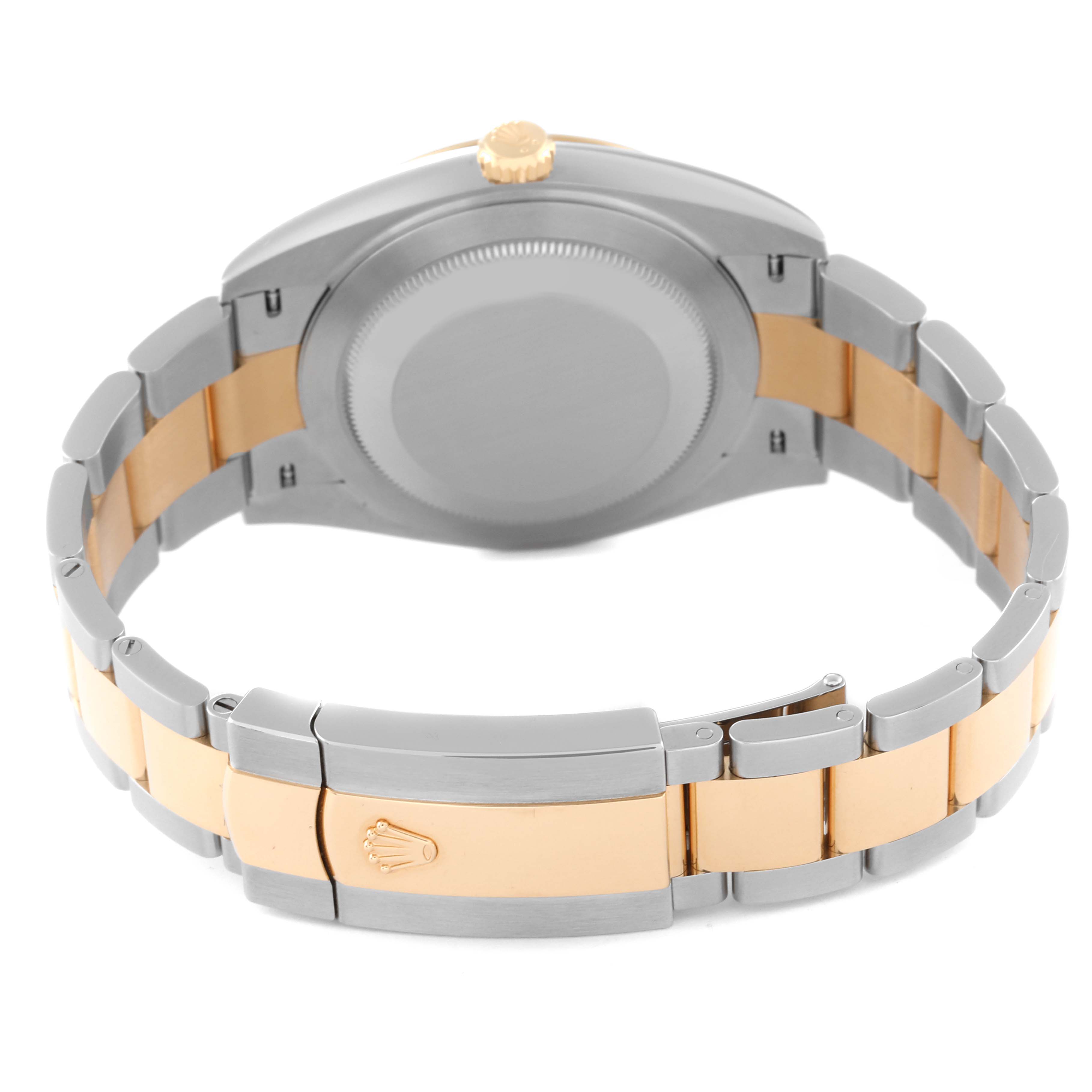 This Rolex Datejust 41 126303 Men's Steel and Gold (two tone) Mother of Pearl Dial 126303 Men's Steel and Gold (two tone) Mother of Pearl Dial watch is shown from the rear, highlighting the case back, two-tone bracelet, and clasp with the Rolex logo.