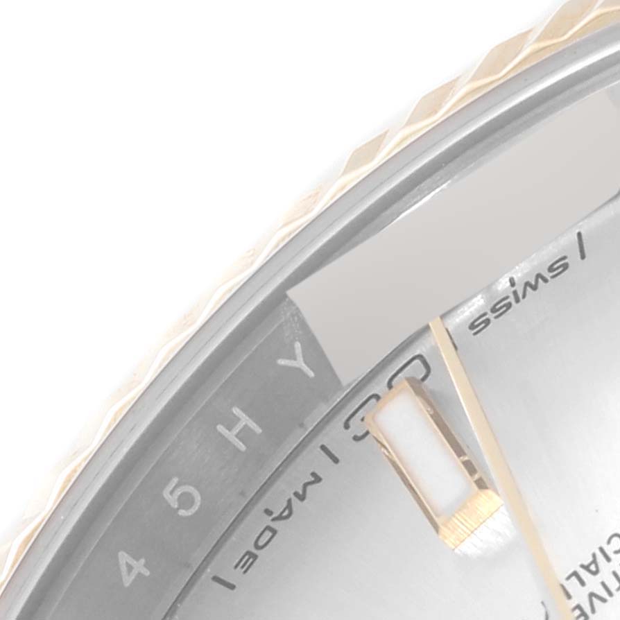 The image shows a close-up of the dial and bezel of a Rolex Datejust 41 126333 Men's Steel and Gold (two tone) Silver Dial 126333 Men's Steel and Gold (two tone) Silver Dial, specifically highlighting the Swiss Made text and part of the minute markers.