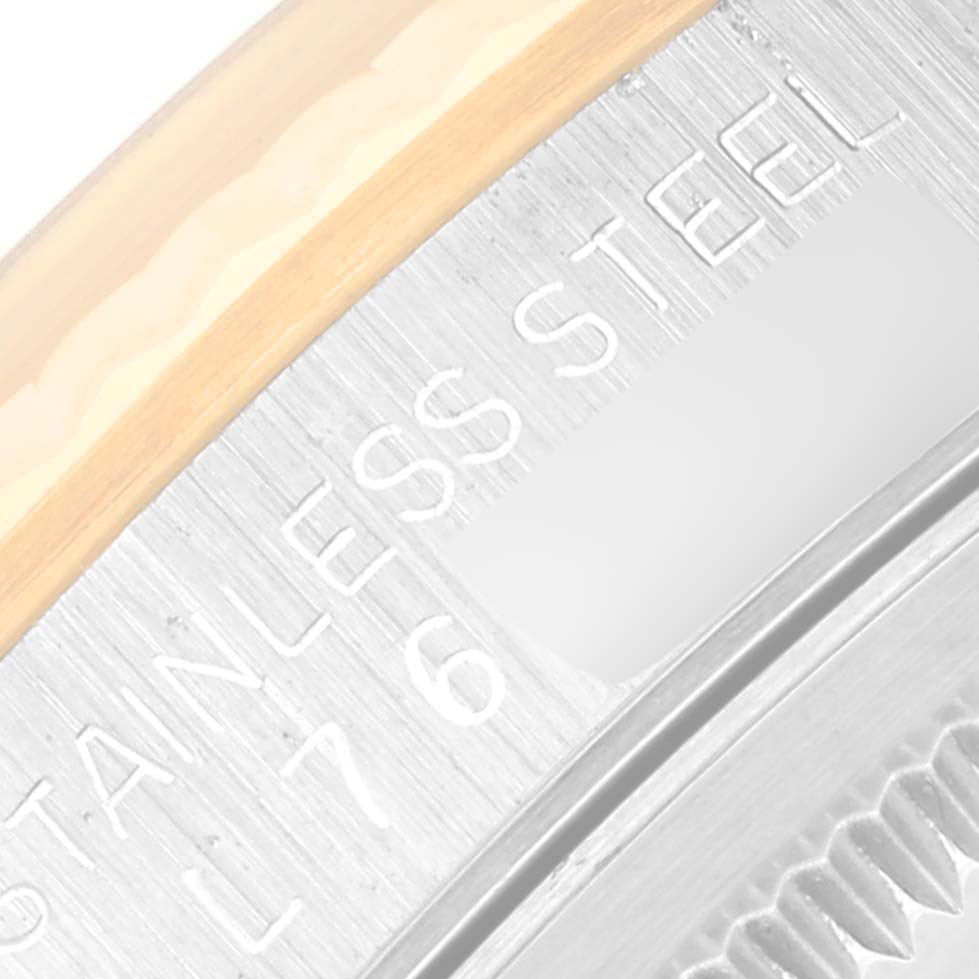 This close-up image shows the stainless steel and gold edge of a Rolex Datejust 16233 Men's Steel and Gold (two tone) Champagne Dial 16233 Men's Steel and Gold (two tone) Champagne Dial watch caseback.